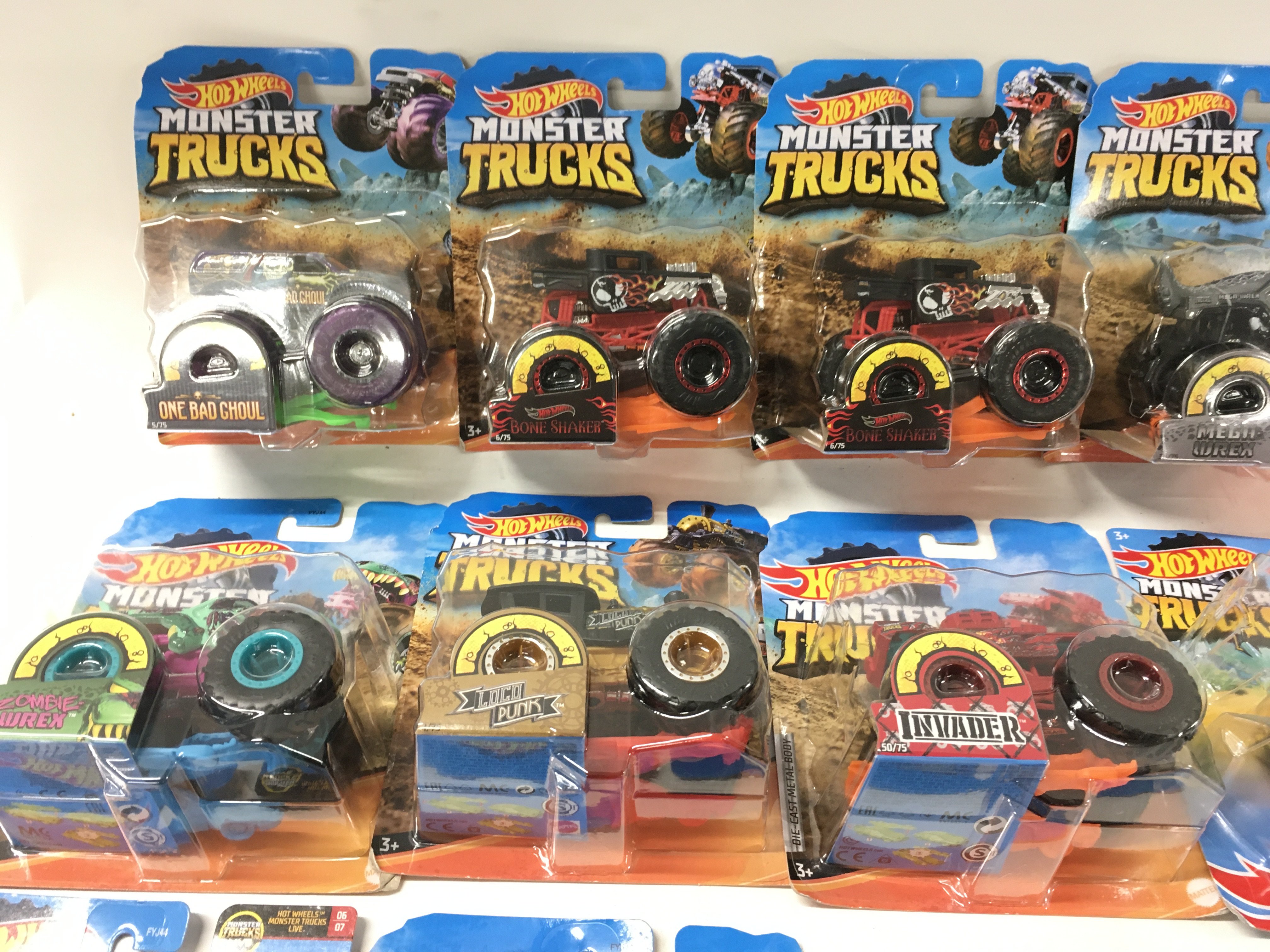A collection of 12 Hot Wheels Monster Trucks 1:64 scale. Includes All Fried Up..Zombie Wrex..plus others. No reserve