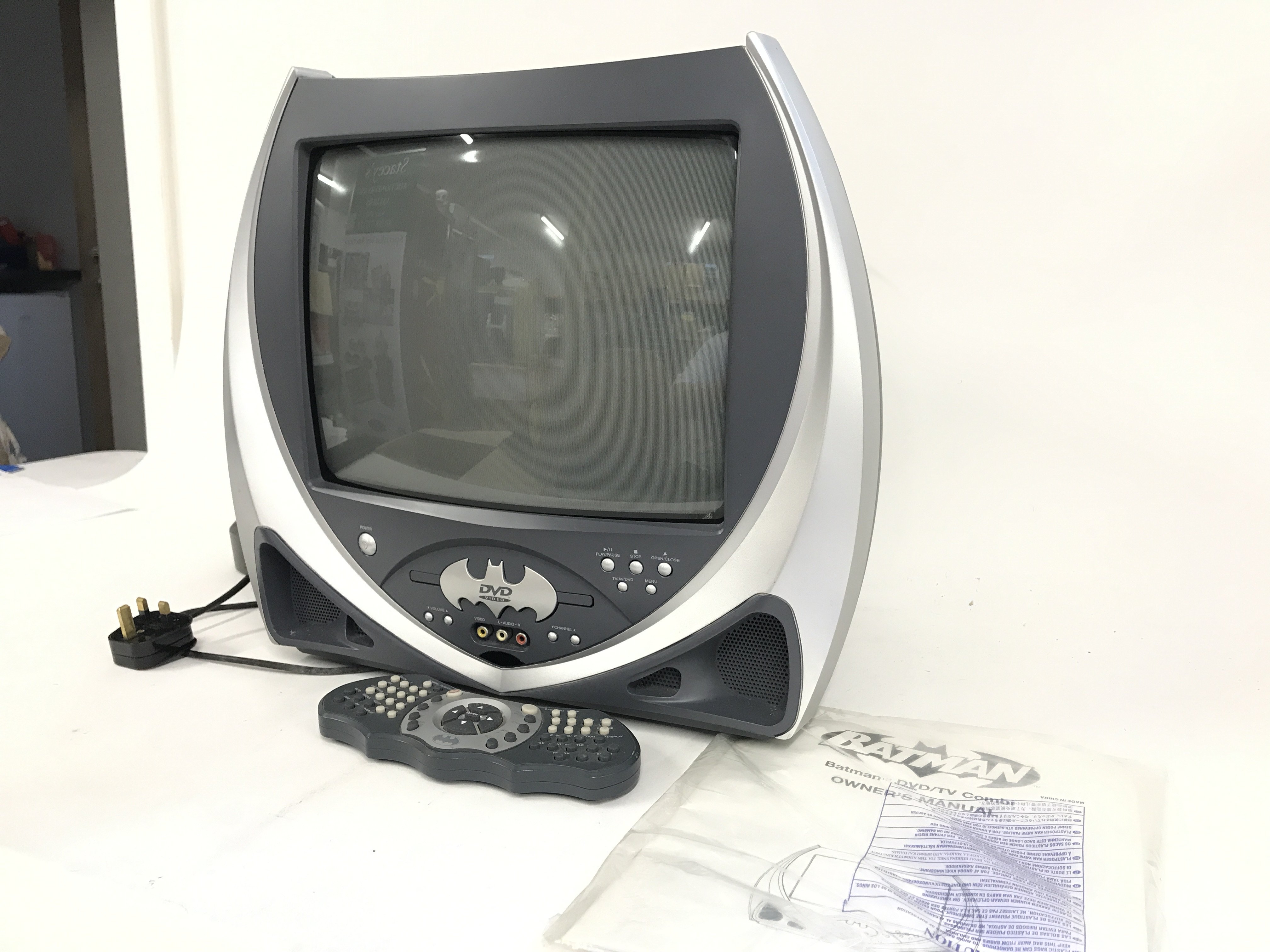 A boxed vintage Batman D.C. comics TV. With built in DVD player. Seen working. Including original owners manual and Batarang shaped remote control. No reserve.