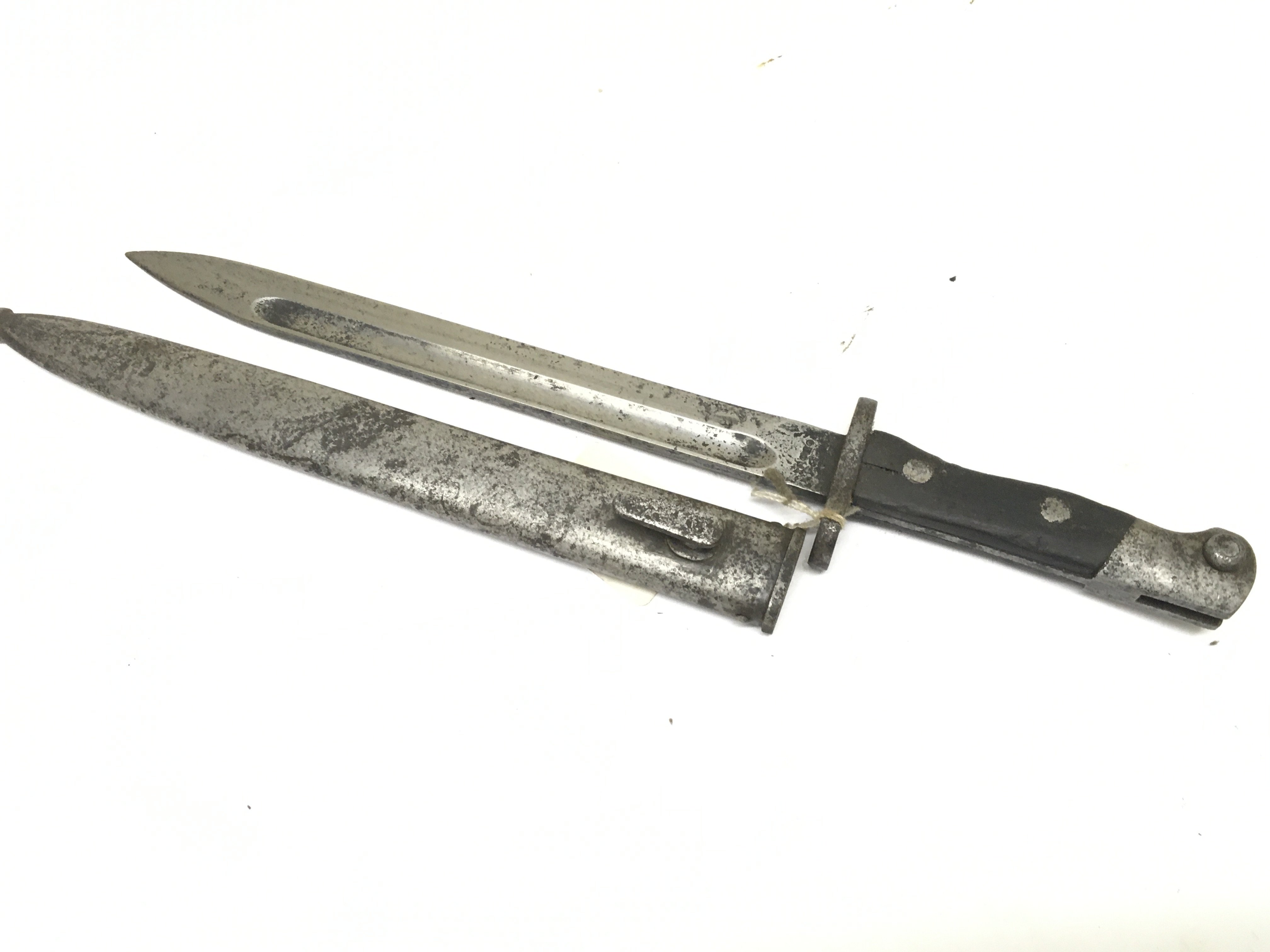 A German K98 German bayonet with wooden grip with unusual marks to the blade.