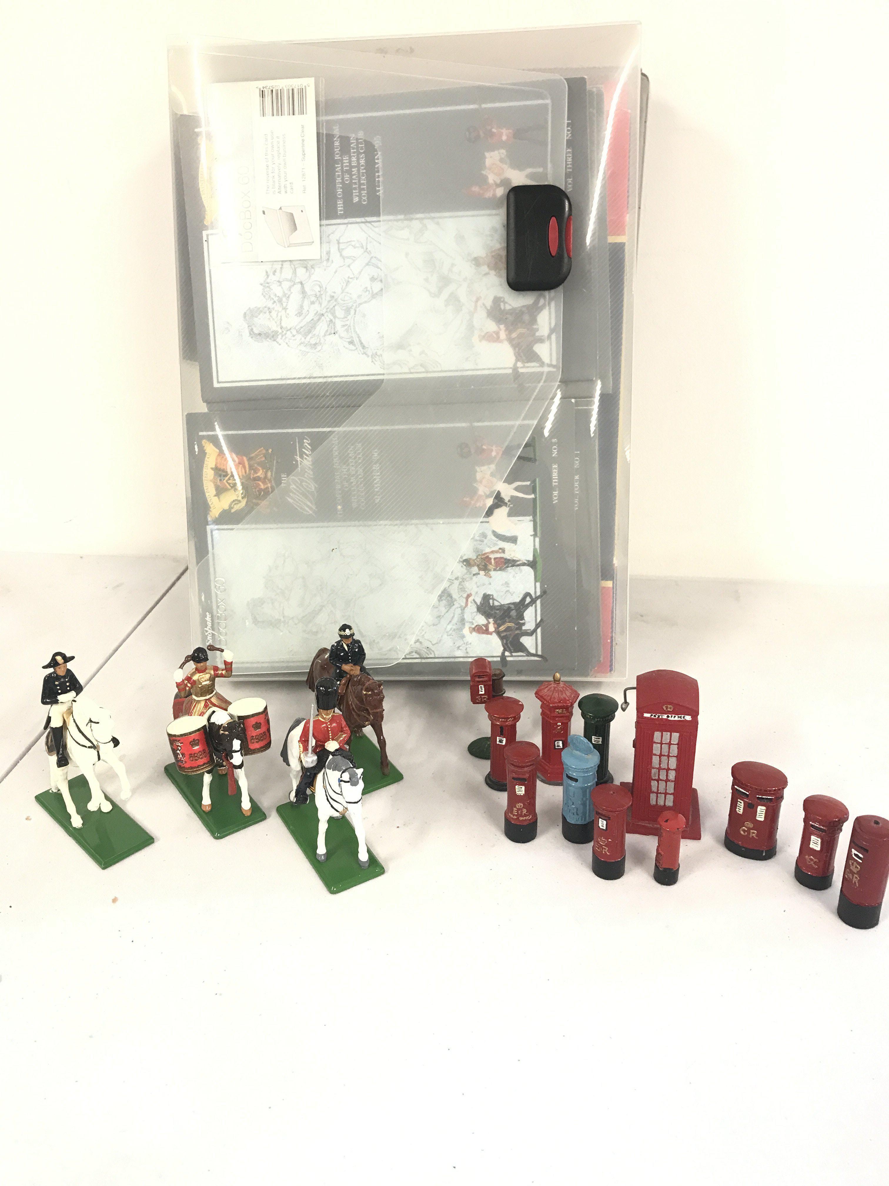 A Small Collection Of loose Britains Figures And A Collection Of Britains Catalogs. No Reserve.
