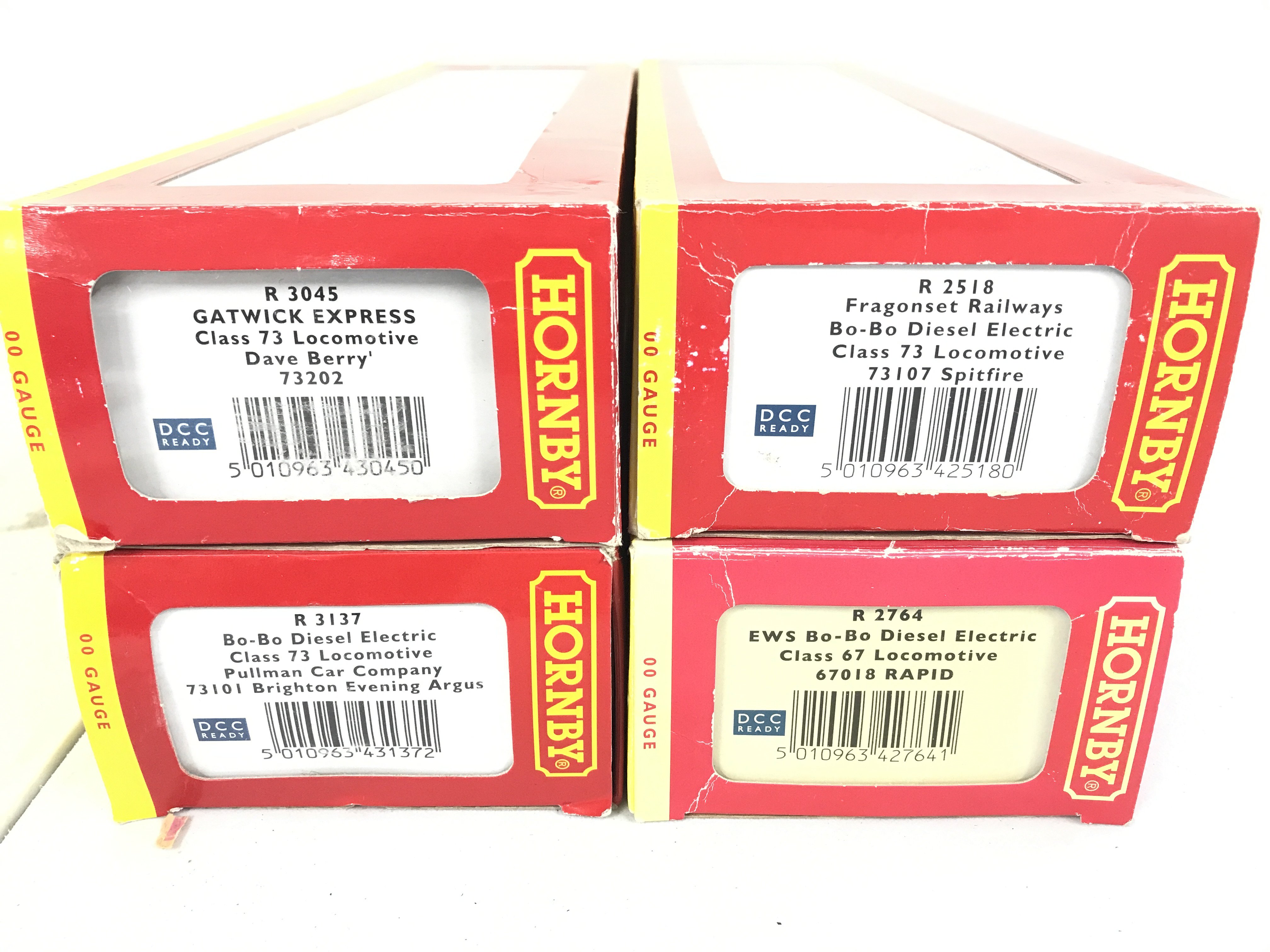 4 Boxed Hornby 00 Gauge Locomotives. A Gatwick Express Class 73 #R3045. A Fragonset Railways Bo-Bo #R2518. A Bo-Bo Diesel Electric #R3137 And A EWS Bo-Bo Diesel Electric #R2764. All DCC Ready No Reserve. (4).