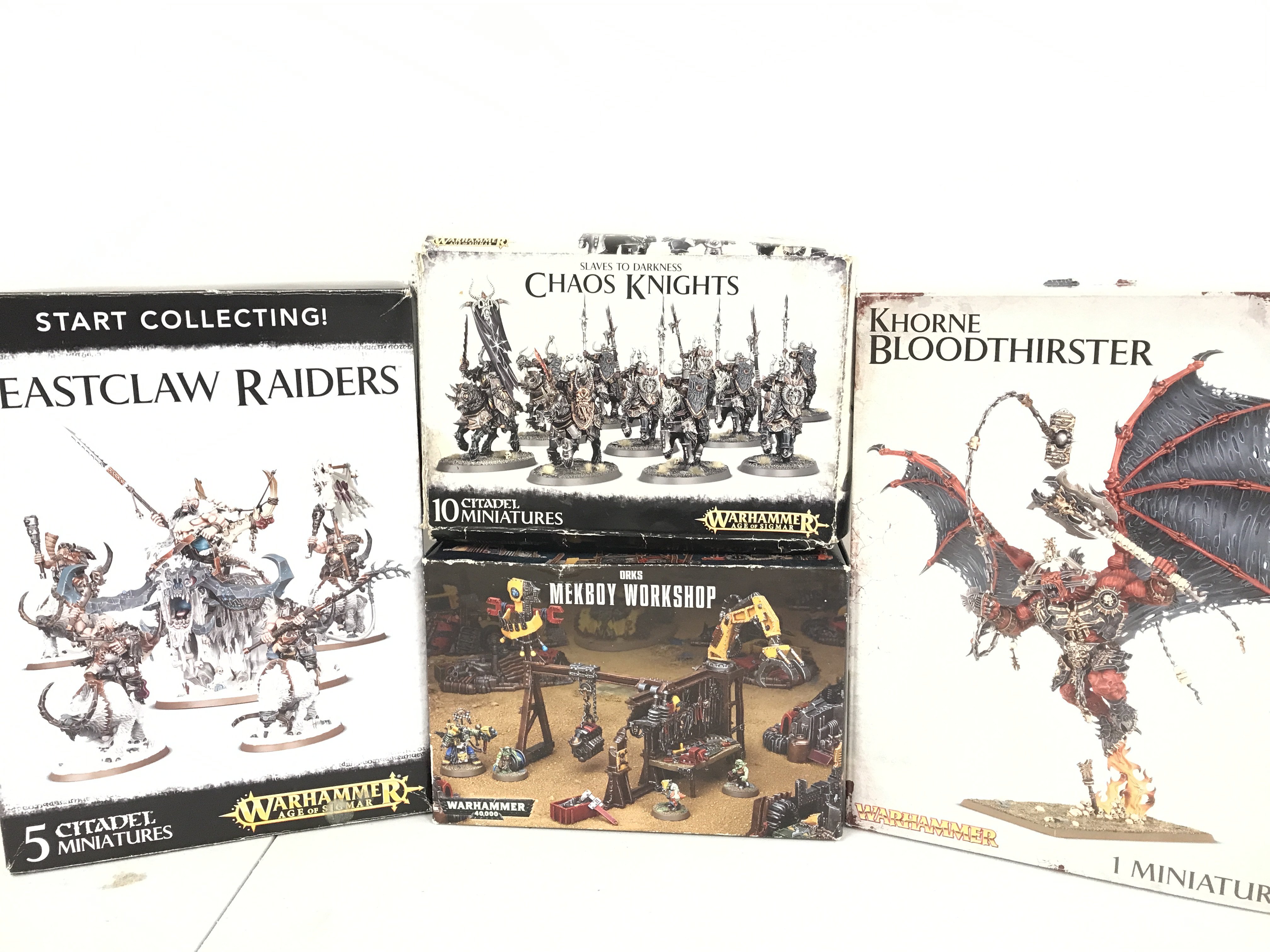 A Collection Of Boxed War Hammer Including Beastclaw Raiders. Chaos Knights. Orks Melbourne Workshop And A Khorne Bloodthirster.(4).