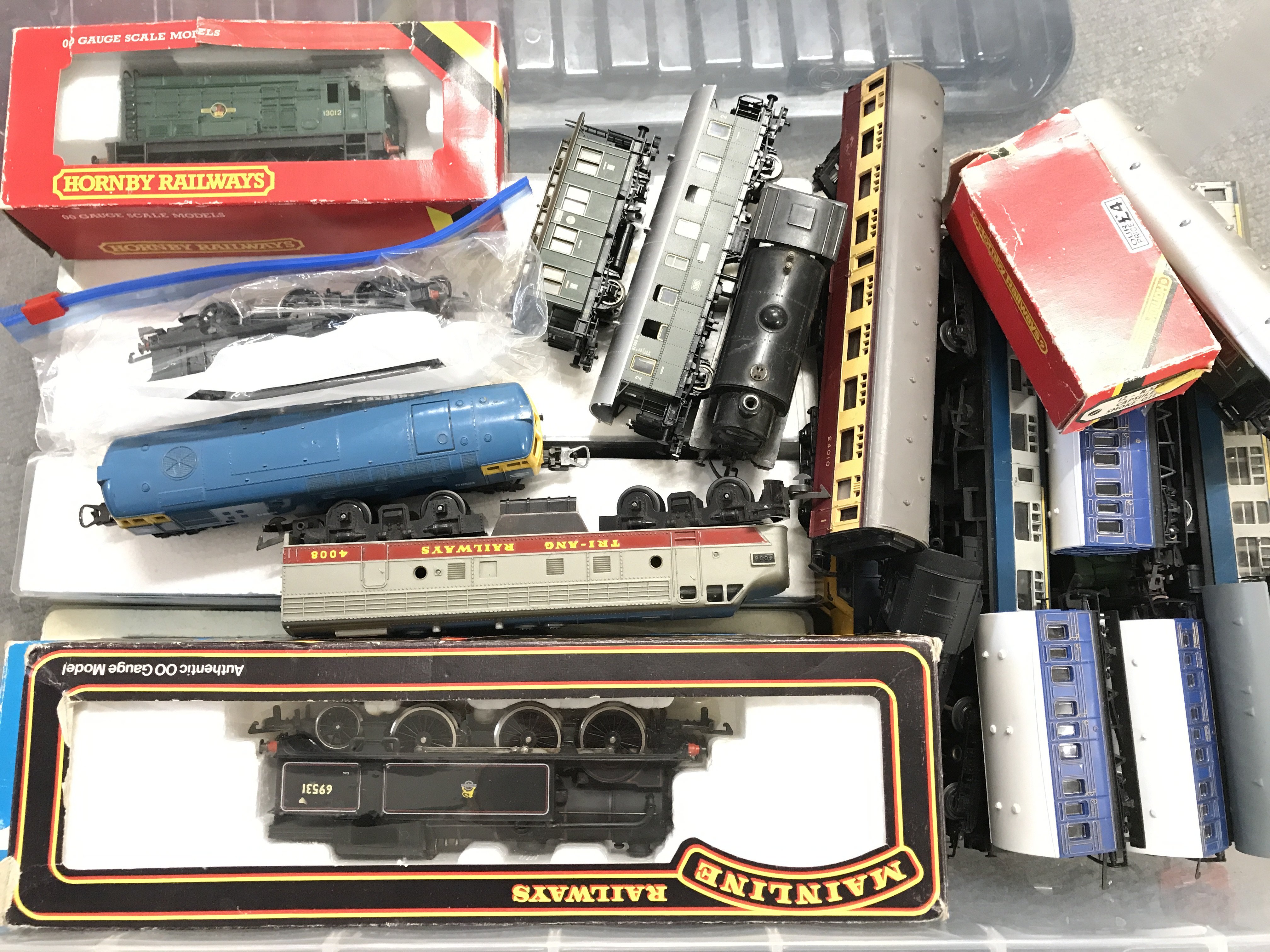 A Box Containing 00 Gauge Locos. Coaches And Wagons With 4 Atlas Models. No Reserve.