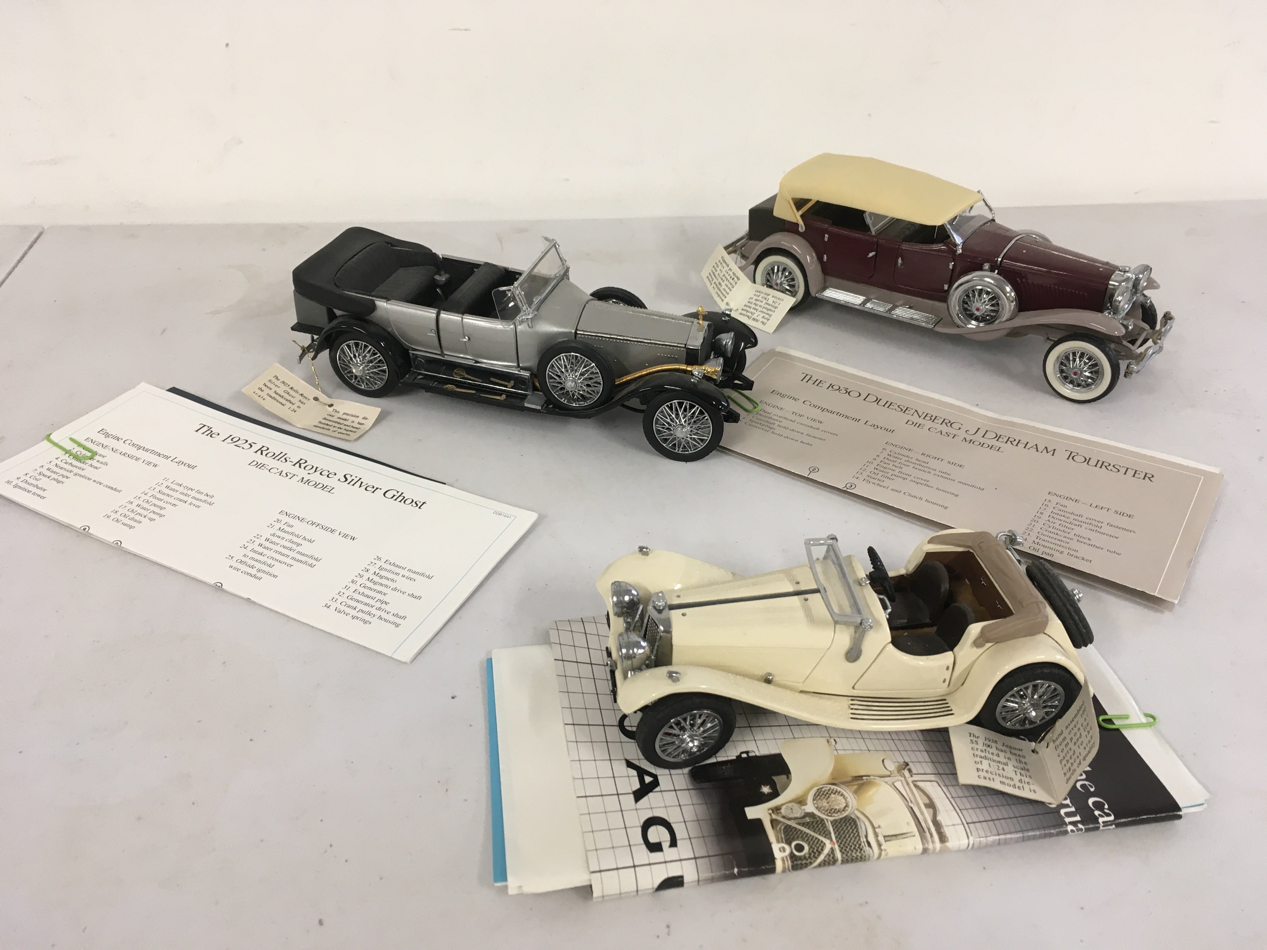 3x Franklin Mint model cars featuring a 1925 Rolls Royce Silver Ghost..1930 Dussenberg J Dereham Tourster and a  1938 Jaguar SS100 all 1..24 scale.  No reserve