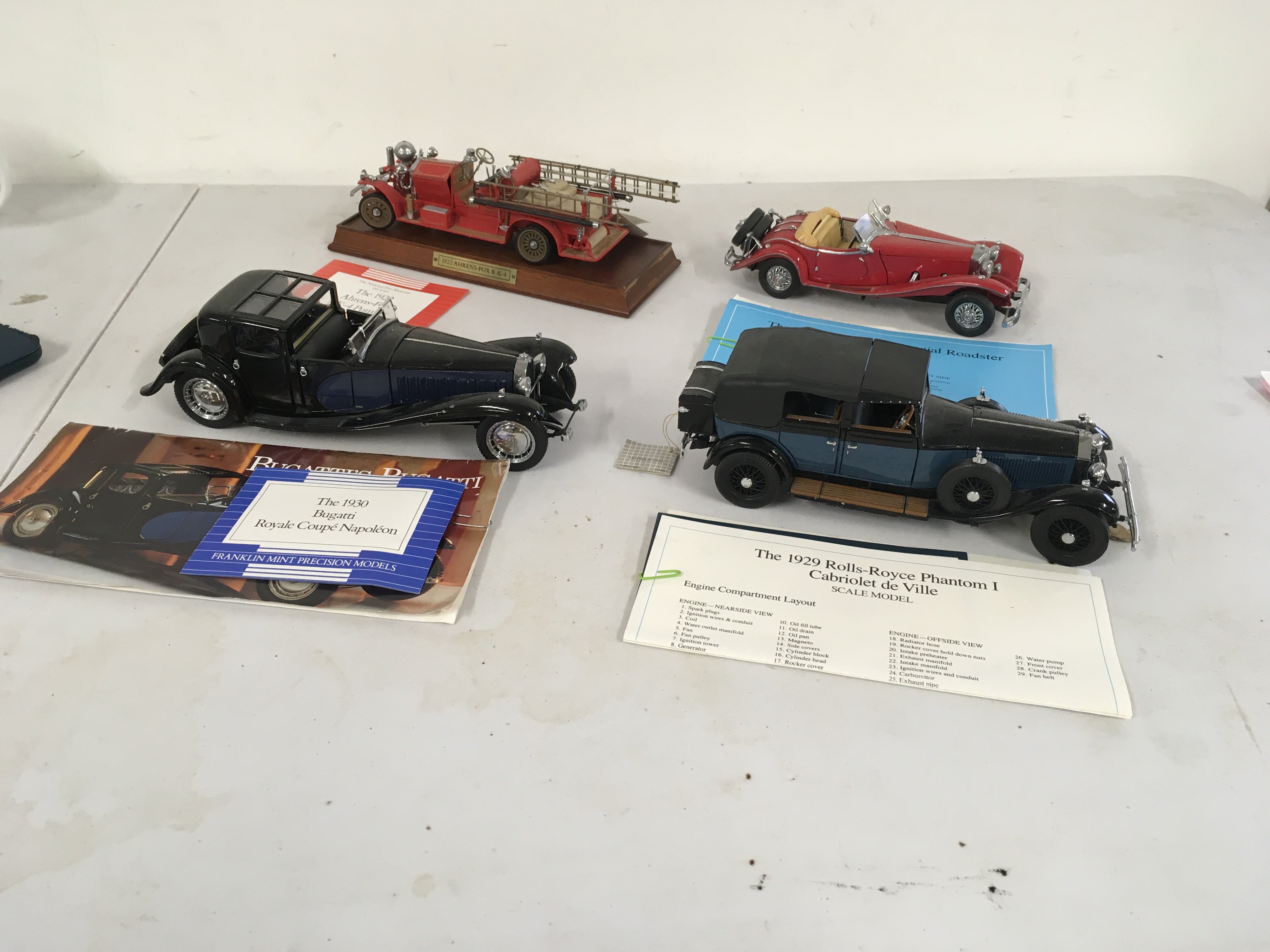 4 x Franklin Mint model cars in 1..24 scale featuring 
1934 Mercedes 500k special roadsterâ€¦1929 Roll Royce Phantom 1 Cabriolet de Ville..  1930 Bugatti Royale Coupe Napoleon and 1922 Ahrens Fox RK4 Pumper. No reserve