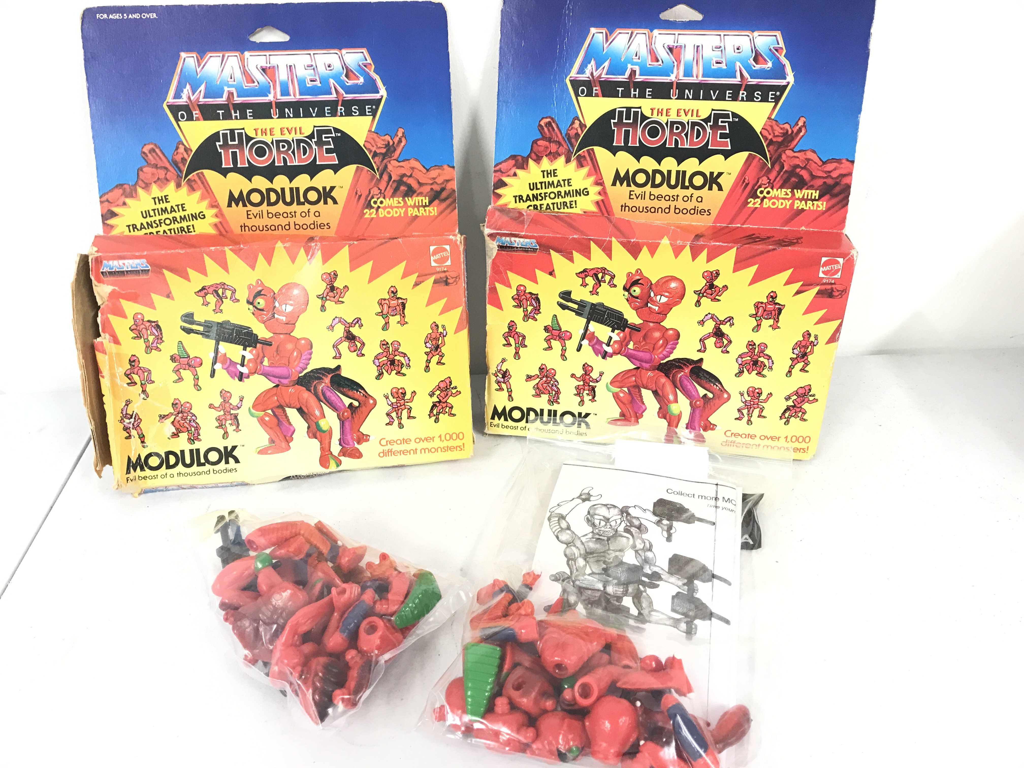 2 Boxed Vintage Masters Of The Universe Modulk Figures. Gun And Arm Missing From 1. Boxes Are Worn. No Reserve.