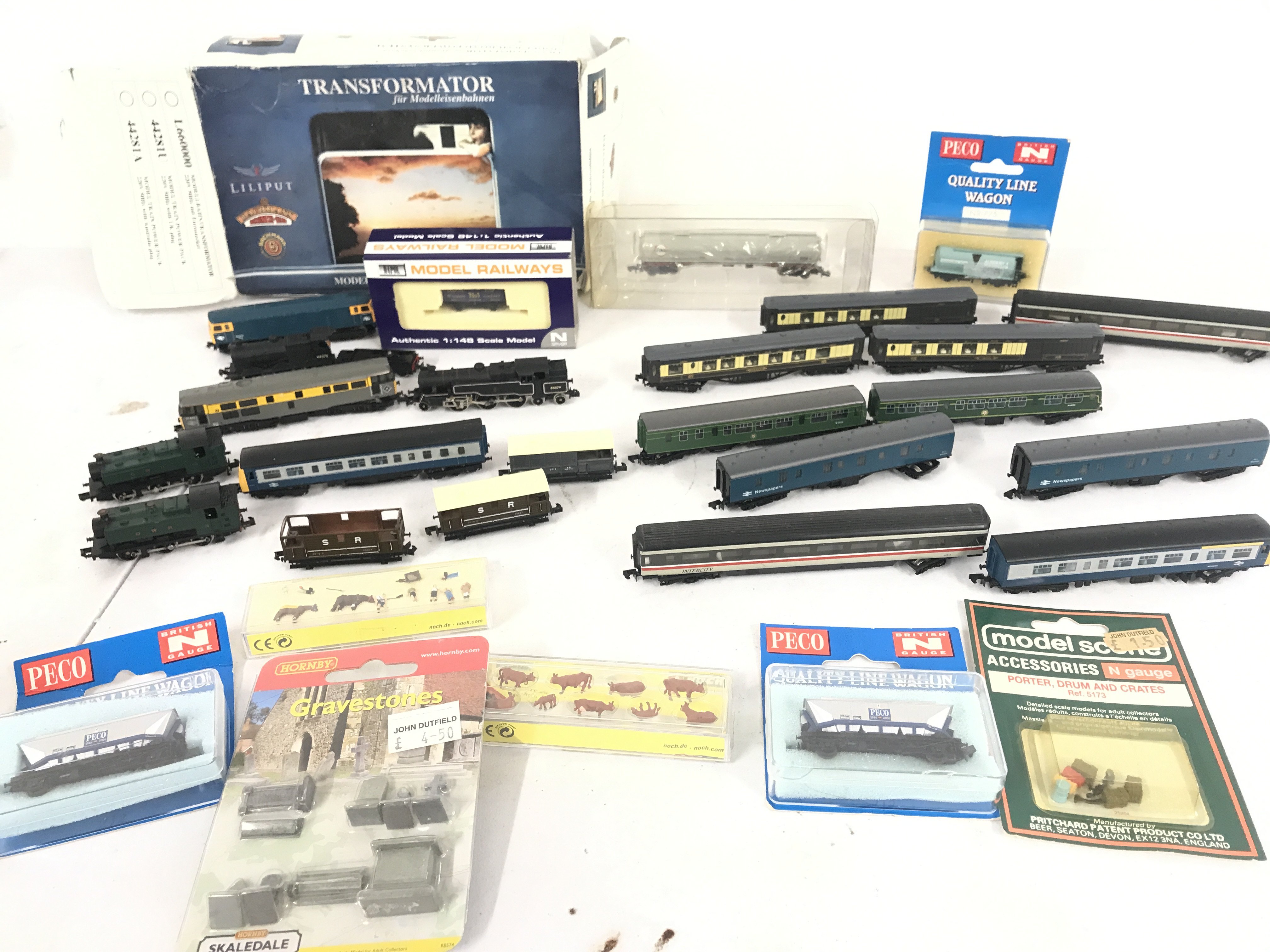 A Collection Of N Gauge Locomotives (2 For Spares) Wagons. Coaches. Accessories And A Transformer.