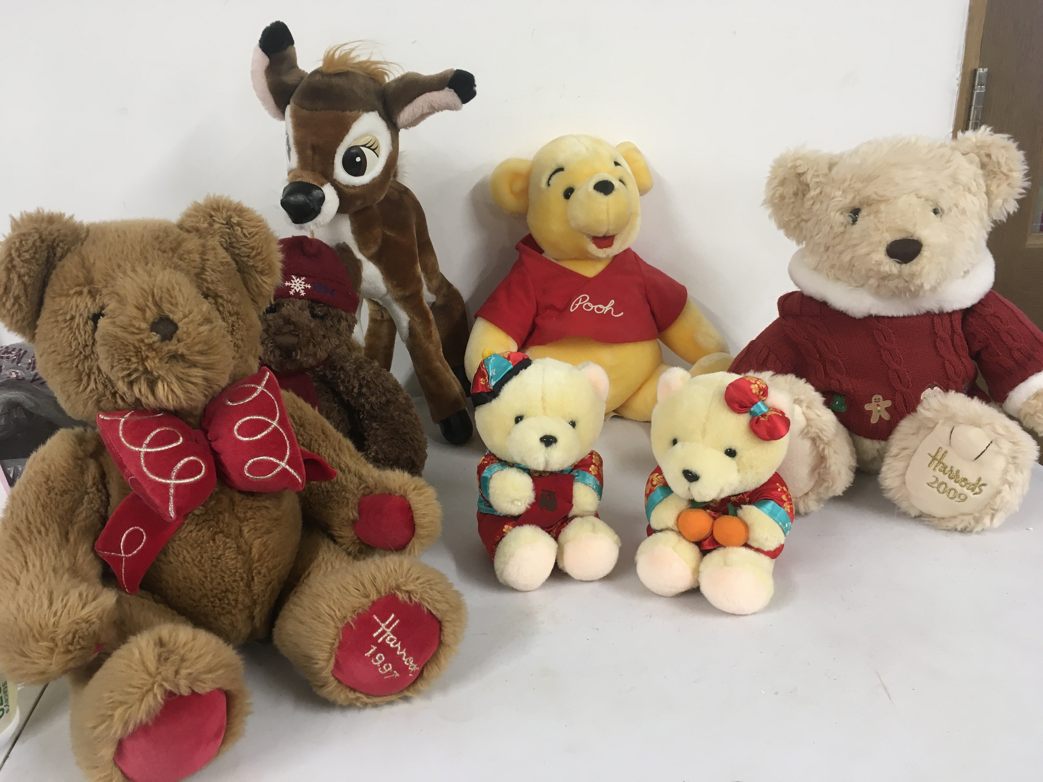 A collection of soft toys including Harrods 1997 and 2009 teddy bears plus Disney Bambi and others.
No reserve 