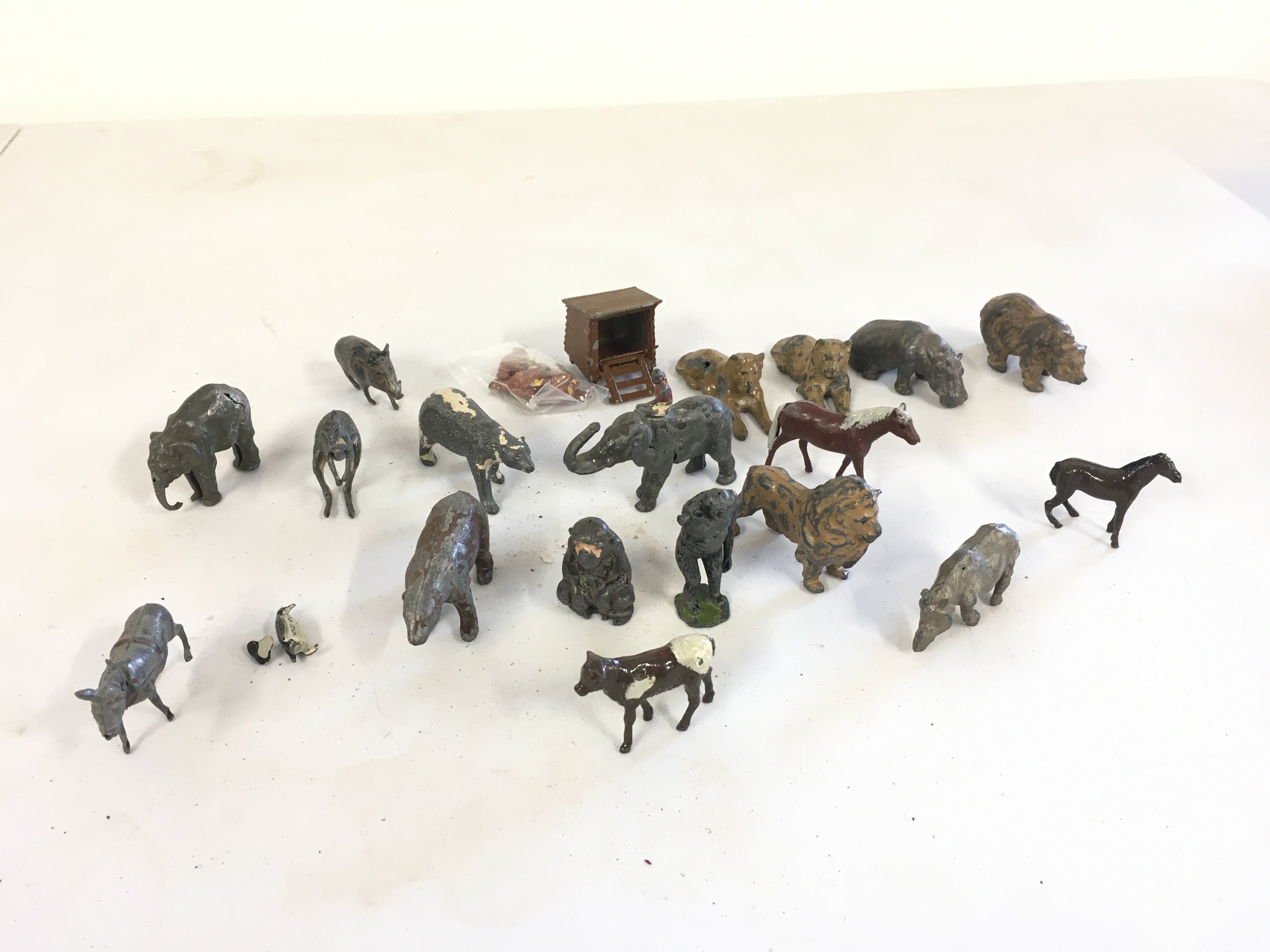 A collection of 20 metal animals featuring farm and jungle creatures by Britains etc.  no reserve