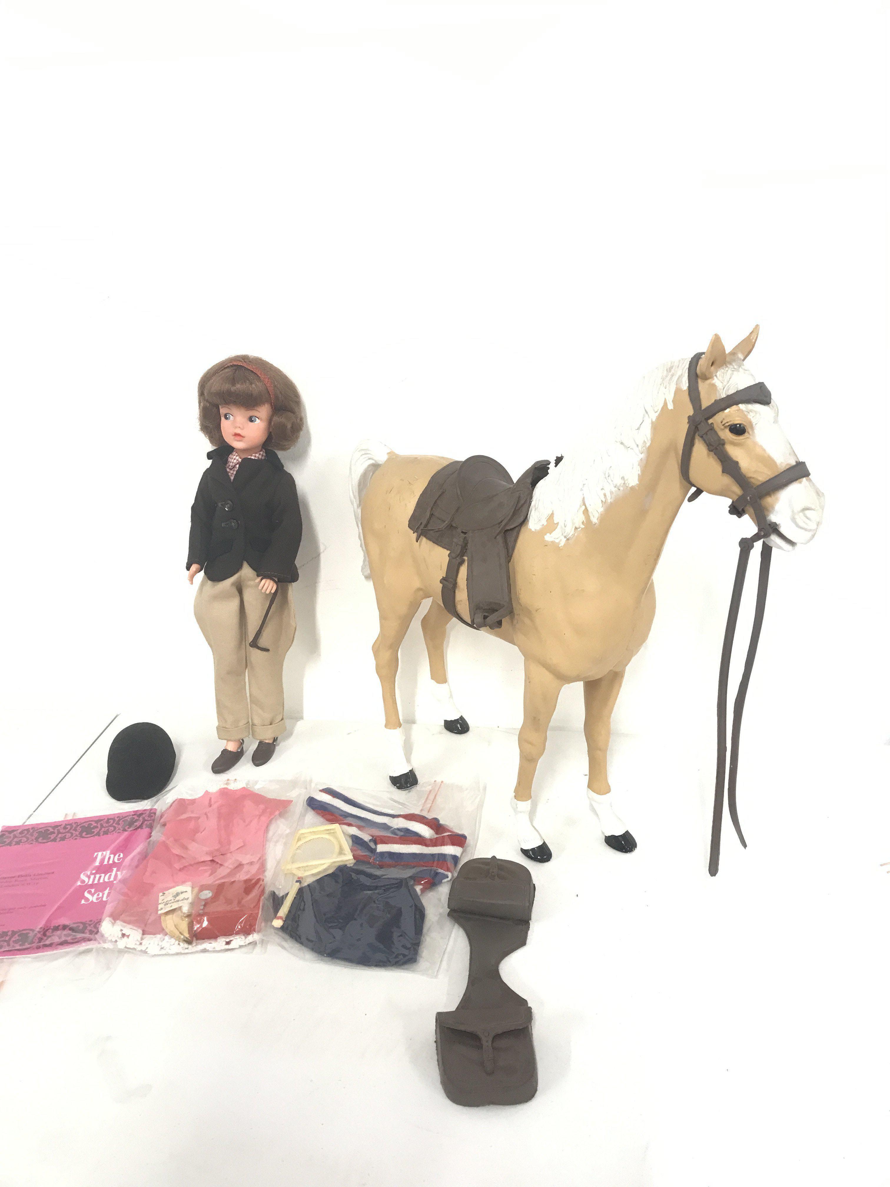 A Vintage Pedigree Sindy Dolls In Horse Riding Outfit. With Other Cloths And A Lone Ranger Horse. No Reserve.