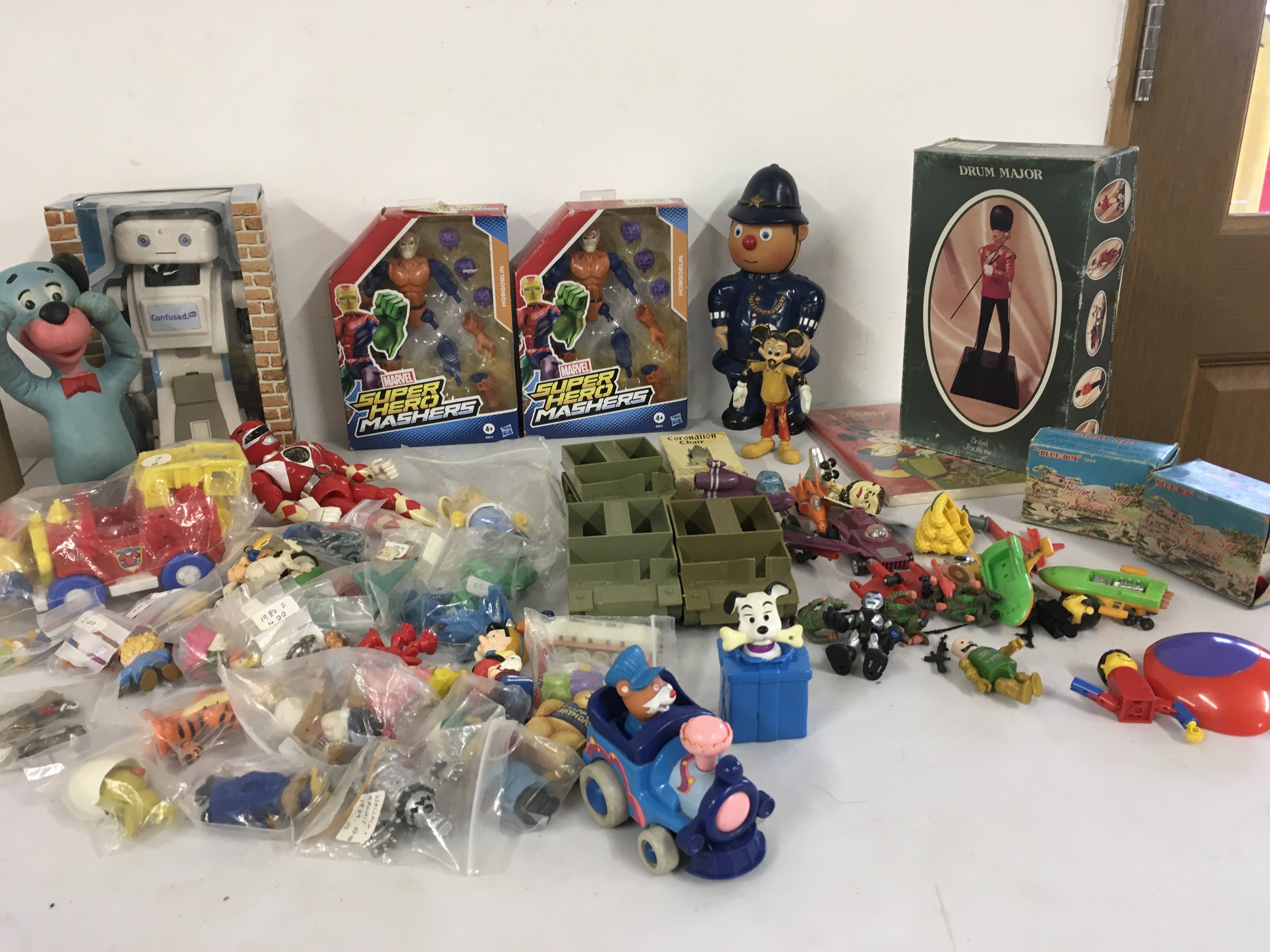 A mixed collection of vintage and newer toys comprising figures..action figures..vehicles..building. Includes Marvel etc. No Reserve
