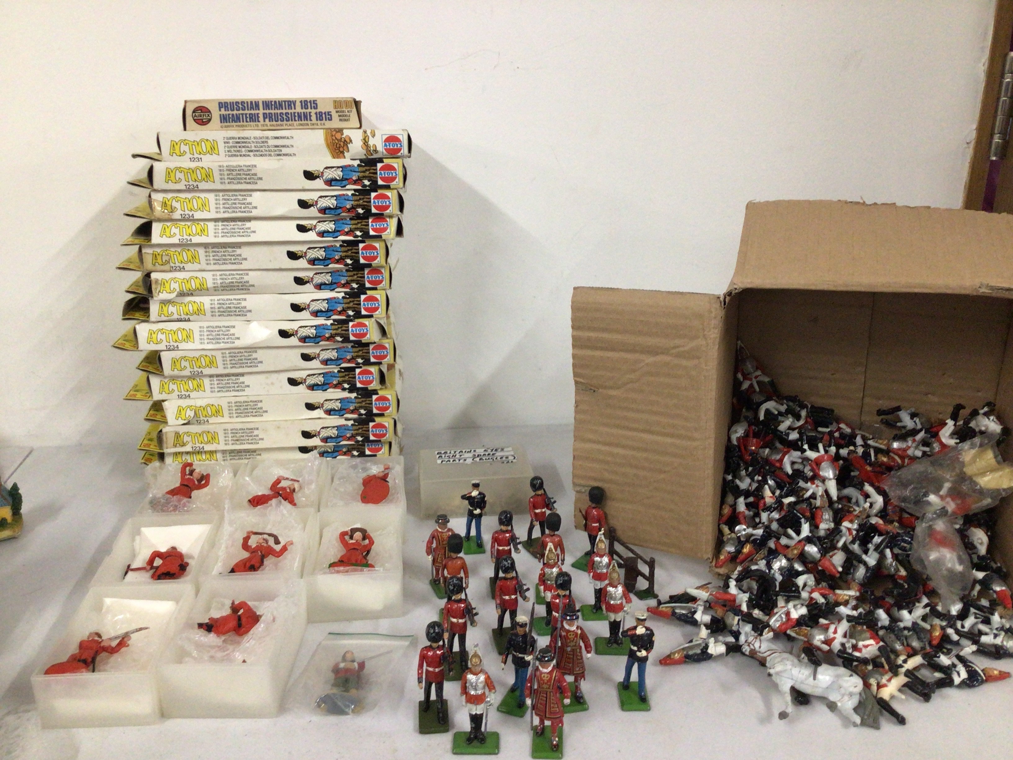 A collection of model Minature soldiers both metal and plastic manufacturers include Britains ..A Toys and others.  Includes 15 boxes of plastic figures.  No reserve