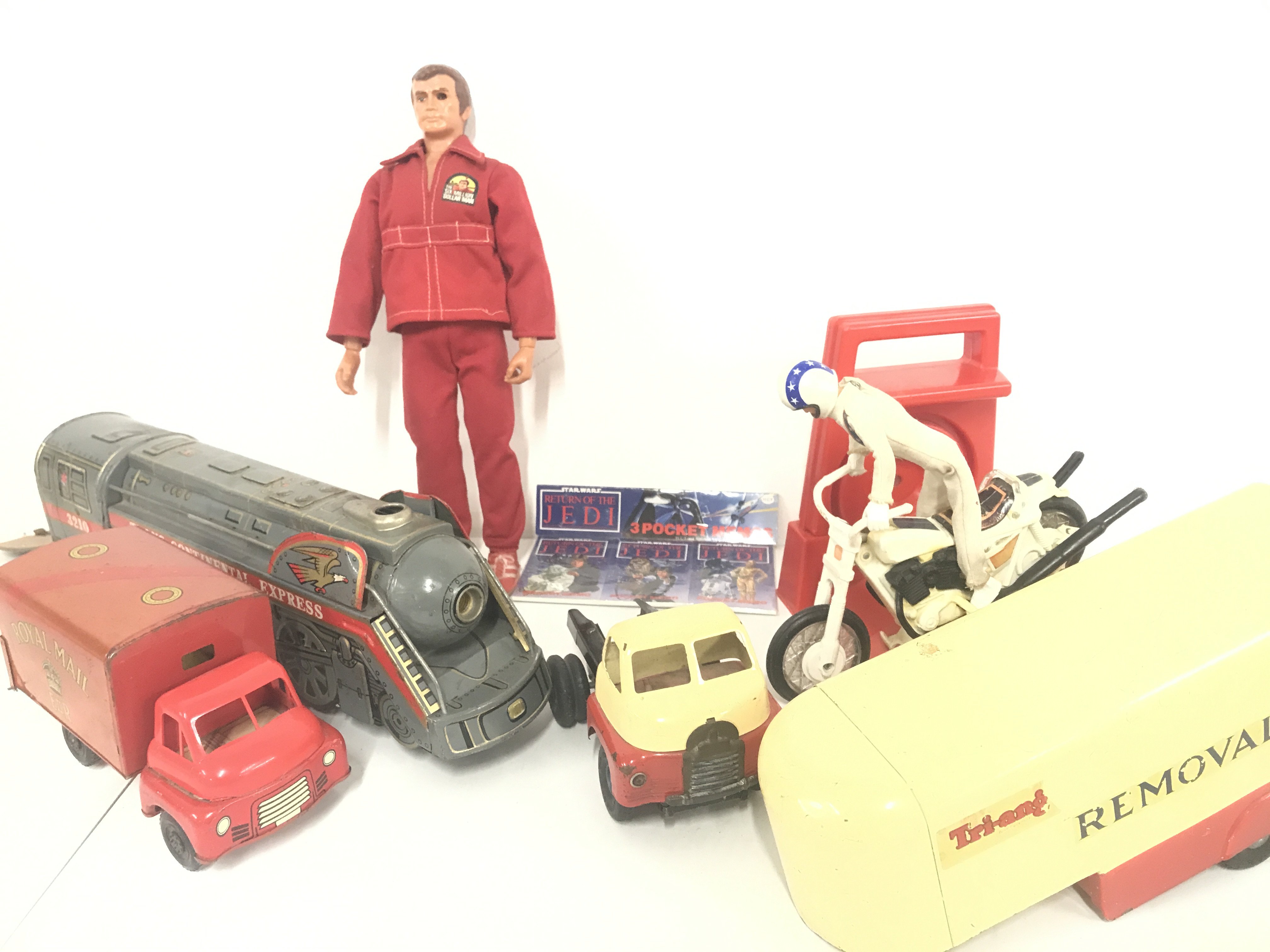 A S:all Collection Of Vintage Toys. A Six Million Dollar Man. A Evel Knievel. A Tri-Ang Removal Lorry. A Batmobile And Bat Copter. etc.