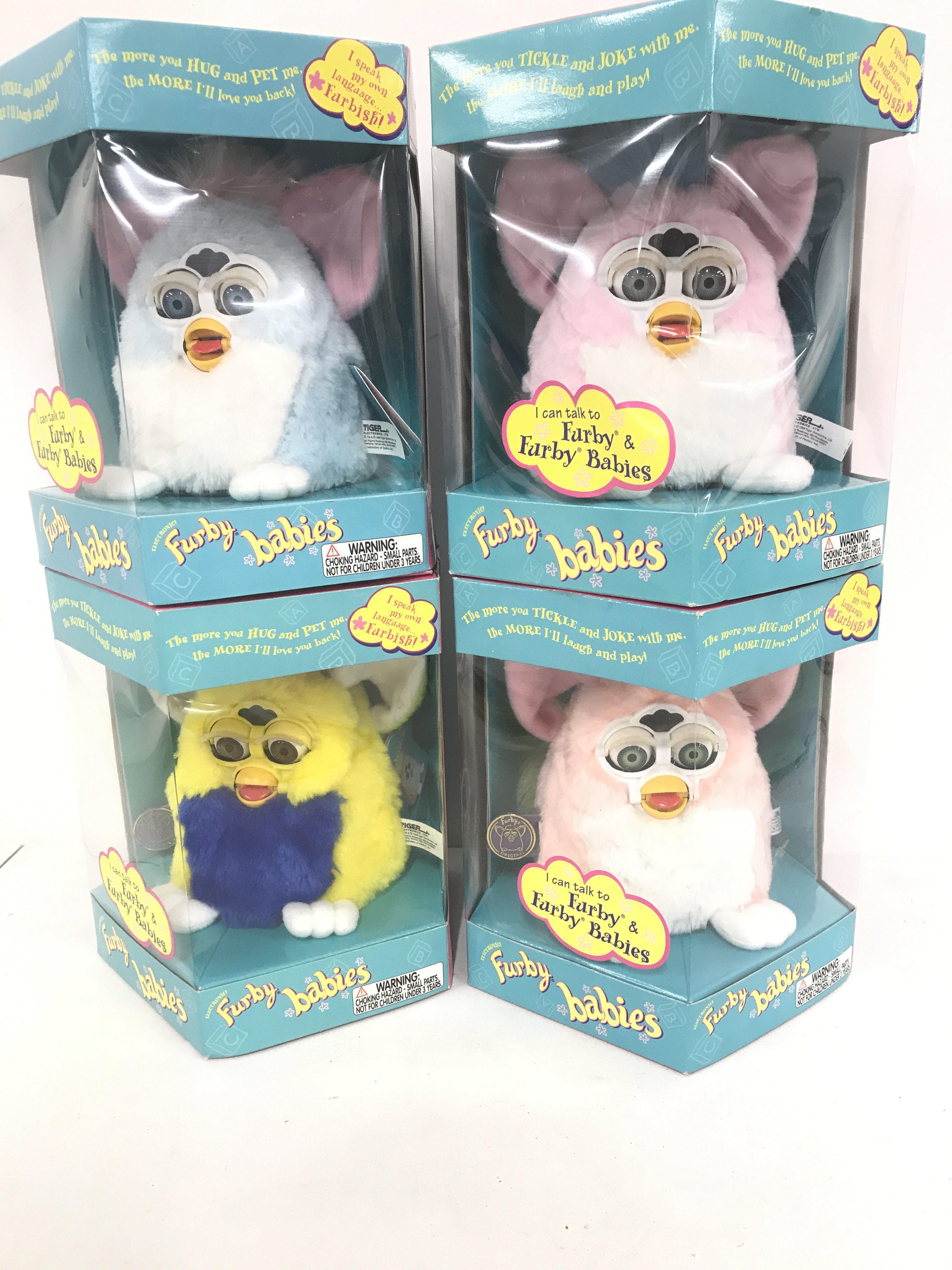 4 Boxed And Sealed Tiger/Hasbro Furby Babies. Including Baby Pink. Primary. Baby Blue And One Other.