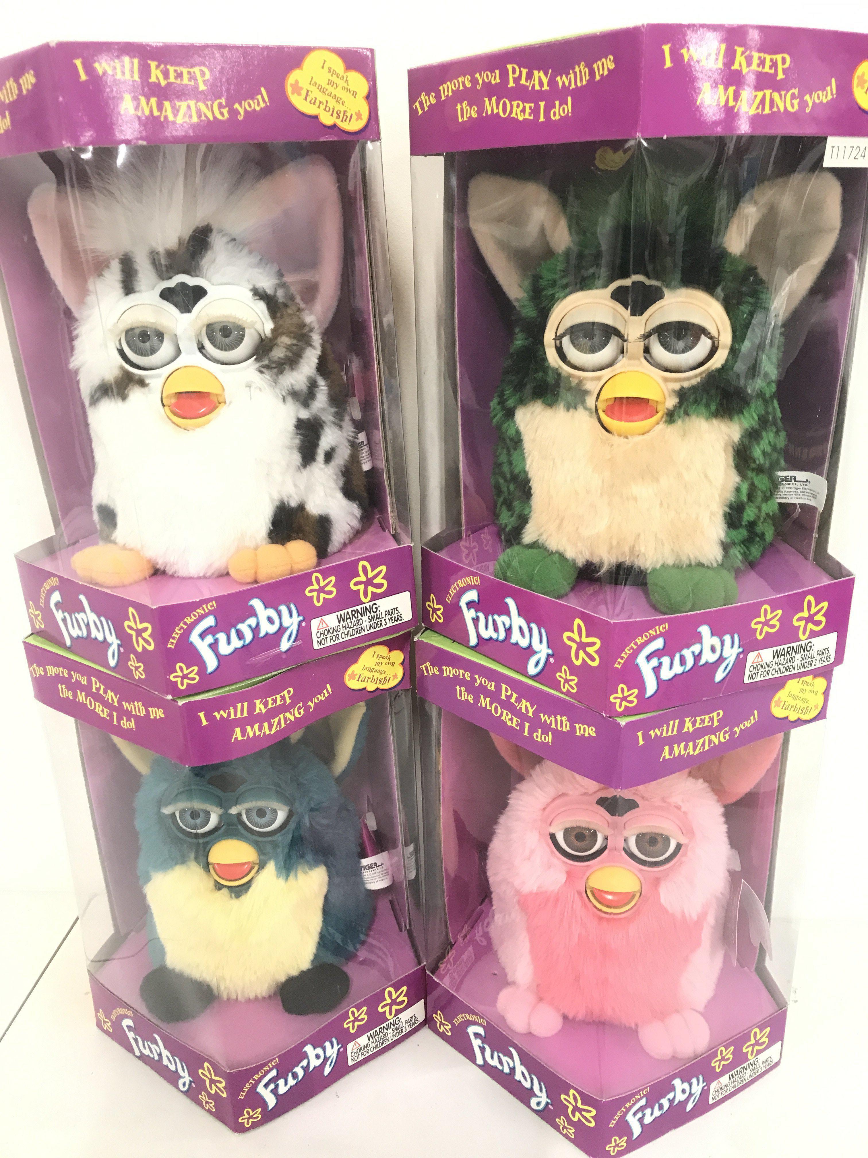 4 Boxed And Sealed Tiger/Hasbro Furbys including Pink Flamingo. Turtle. Snow Leopard. And Dragon.