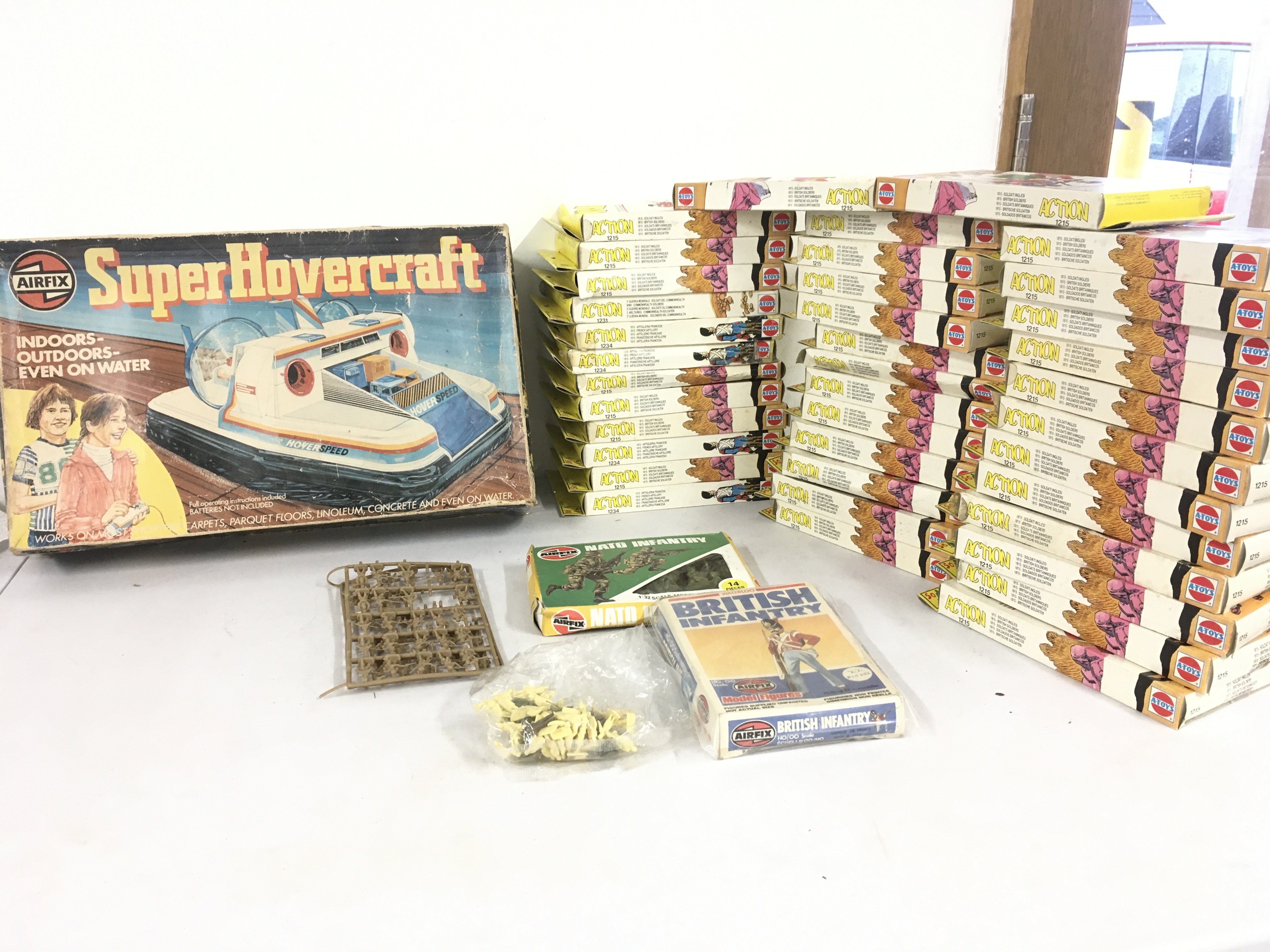 A collection in excess of 35 boxed model soldiers by AToys.  Also includes 2x boxed Airfix figures and 2 loose sets of figures.  Plus a boxed vintage Airfix Super Hovercraft.  No reserve