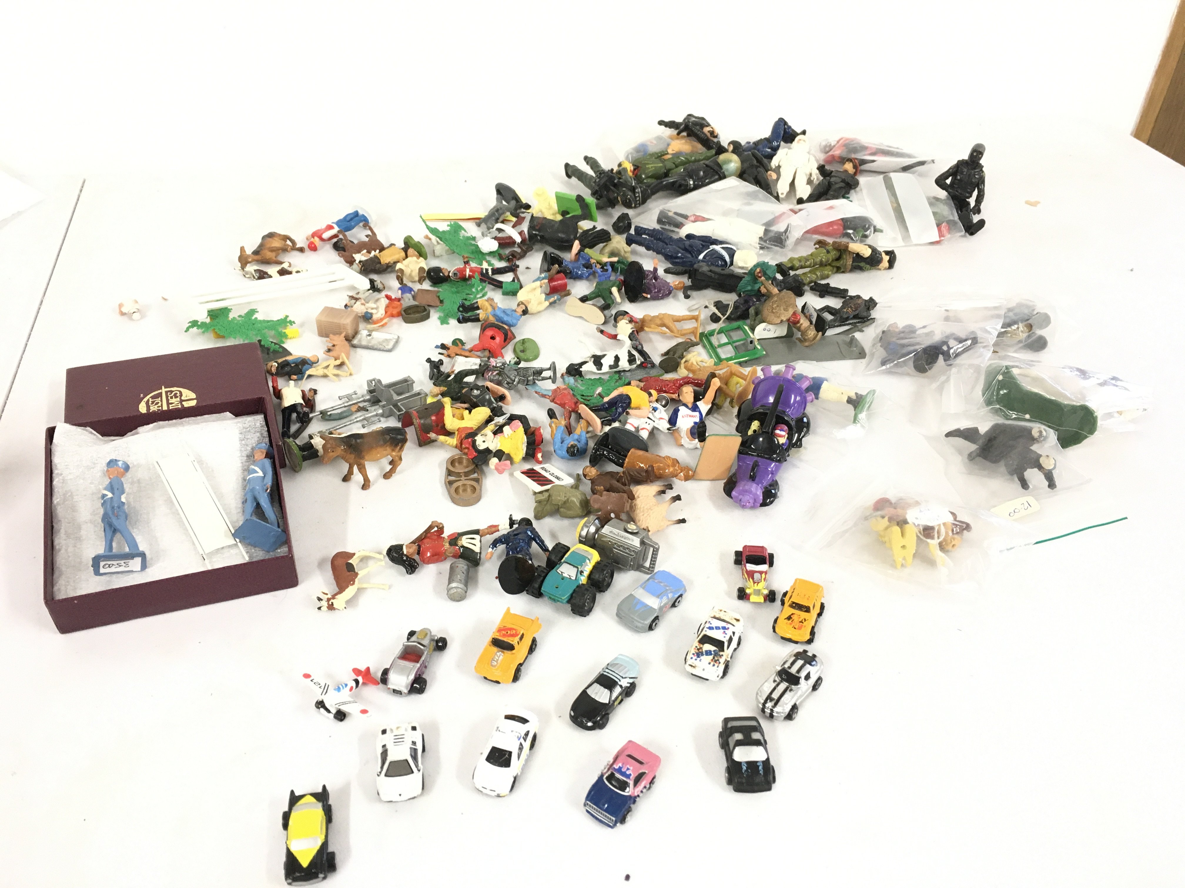 A collection of action force figures. Plus a mixture of othe diecast and plastic figures by Britains and others includes some micro machines.  No reserve