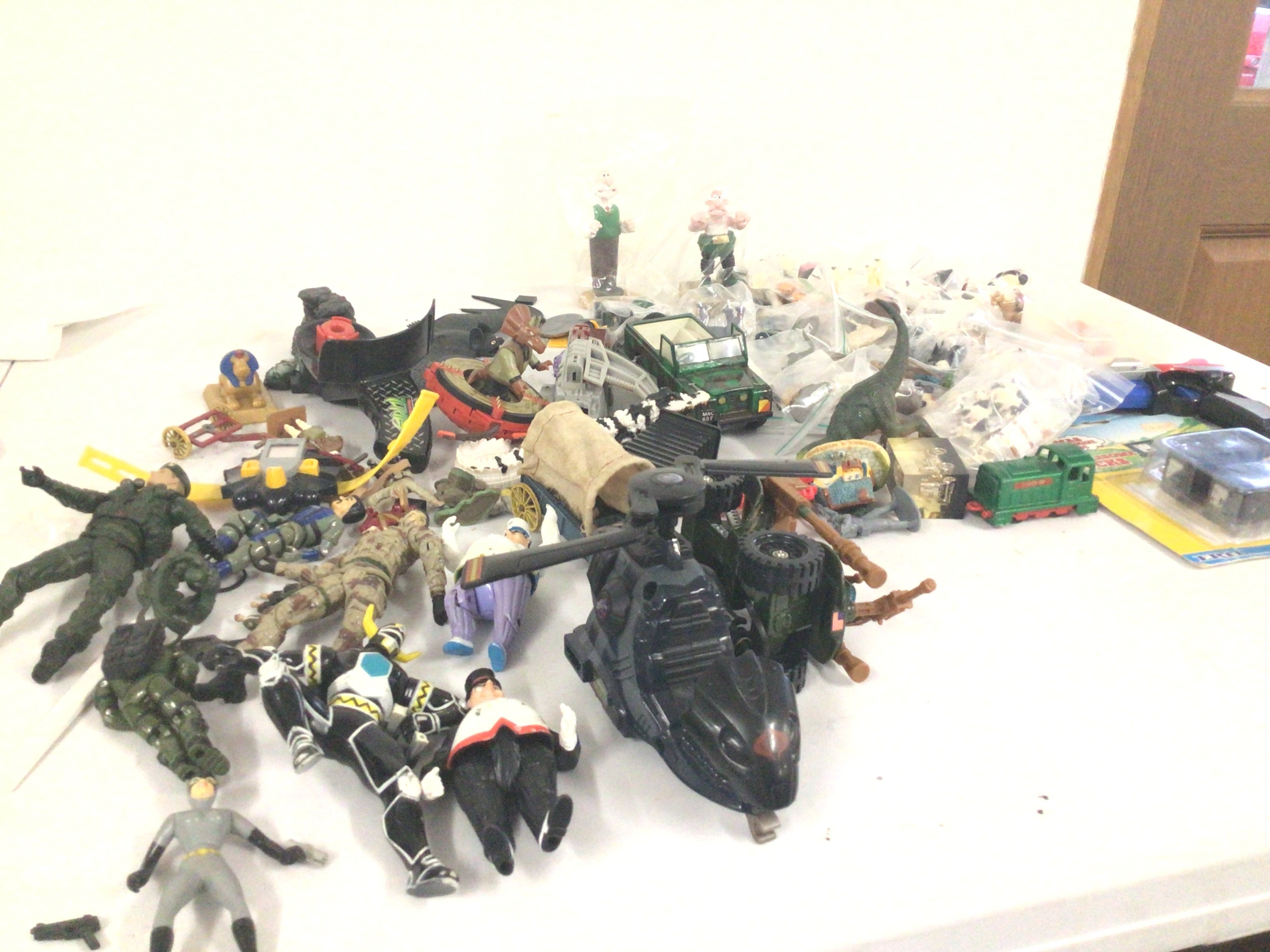 A mixed collection of action figures..animals..plus others including vehicles.  No reserve