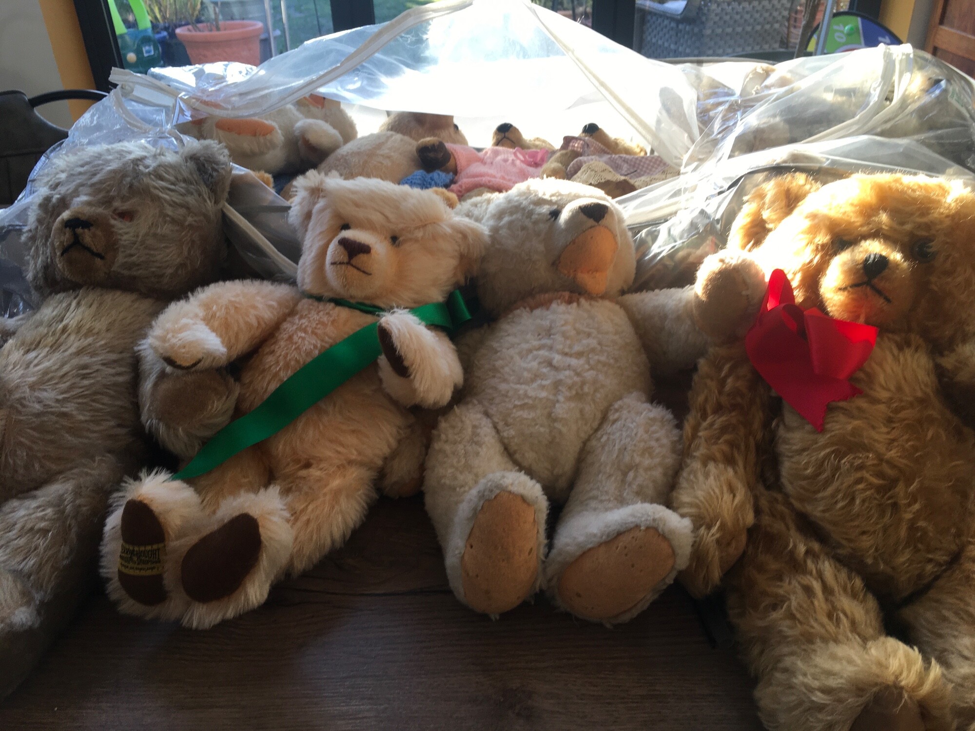 A collection in excess of 15 plush teddy bears of varying vintage and condition manufacturers include Deans, Merry Tmhought etc.  no reserve.