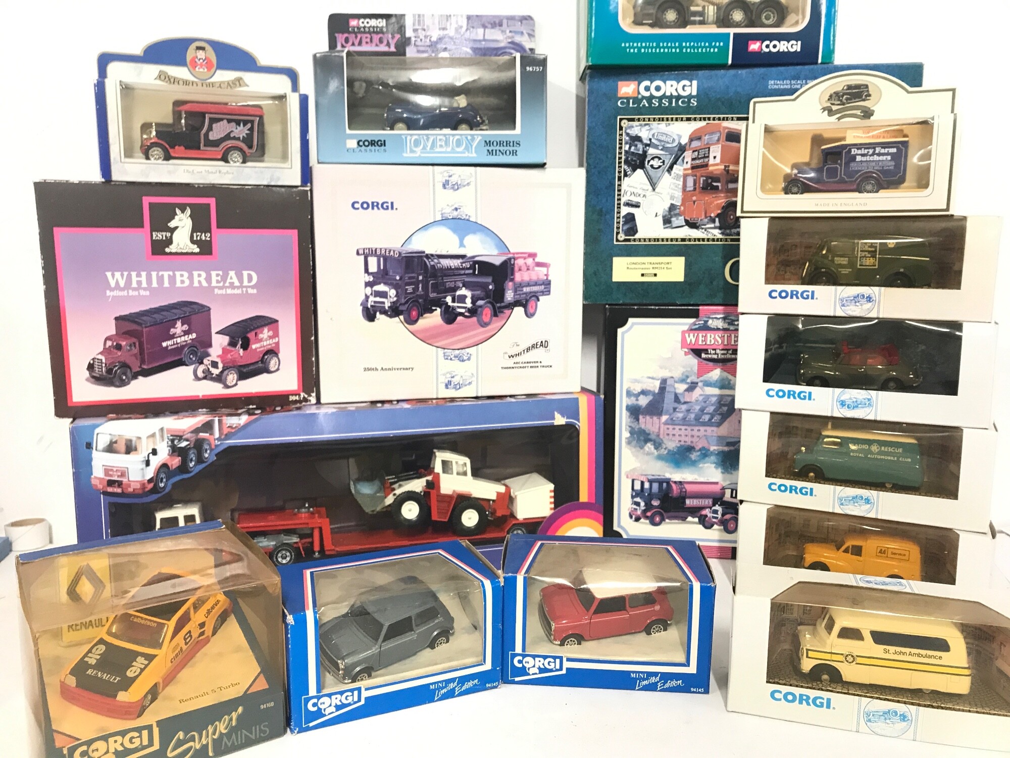 A Collection Of Boxed Corgi Vehicles And A Siku MAN Larry With Trailer And Bulldozer.
