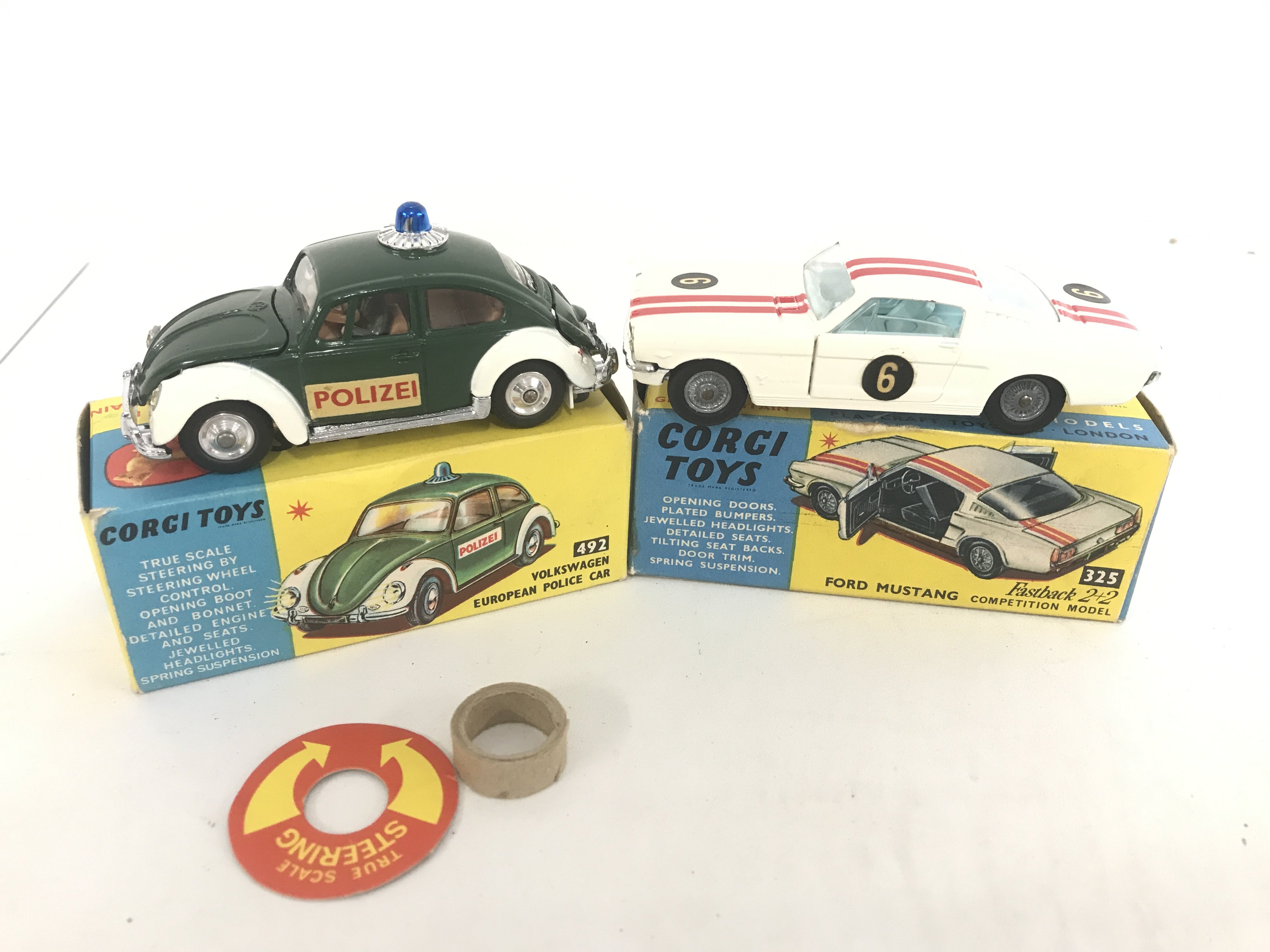 A Boxed Corgi Volkswagen European Police Car #492 And A Ford Mustang #325. No Reserve.