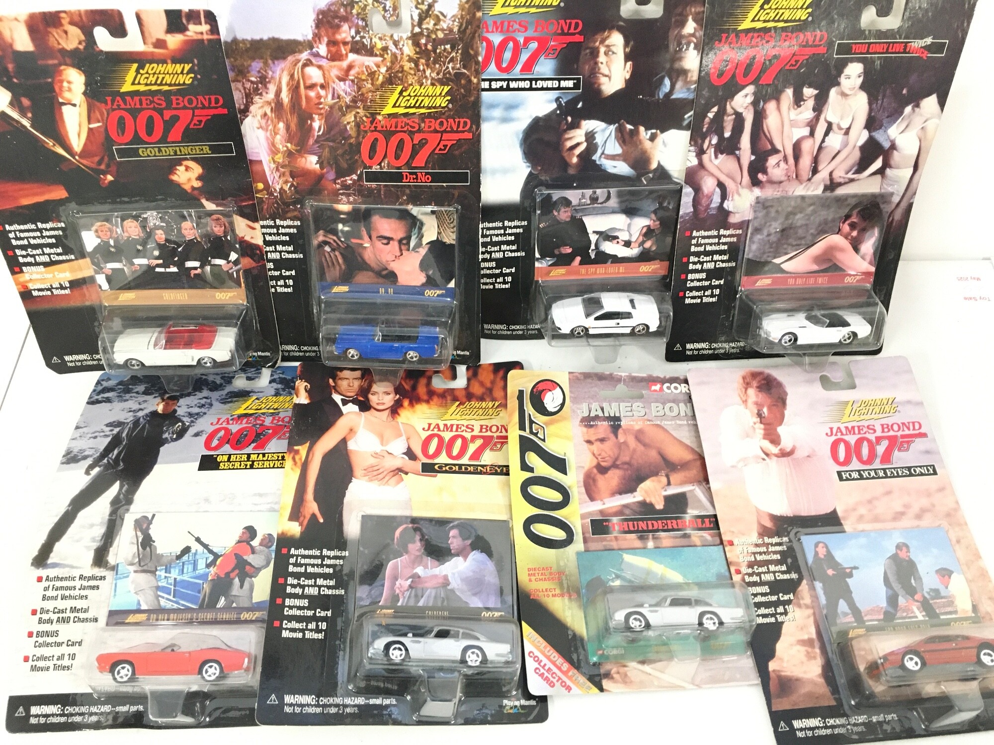 a Collection Of Carded Johnny Lightning/Corgi James Bond Diecast Cars.