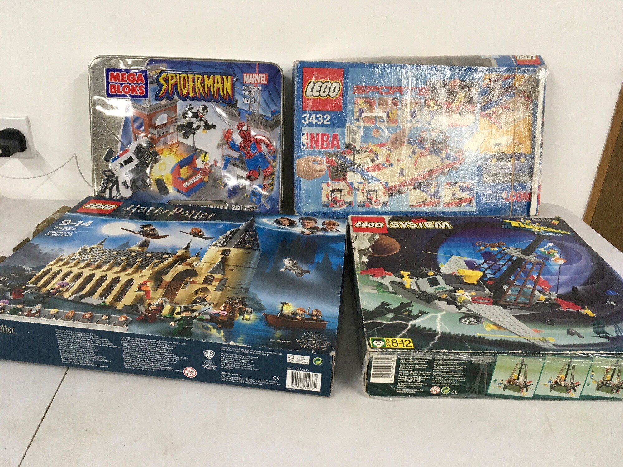 A collection of 3 Lego  75954, 6493, 3432 sets and 1 Mega Bloks Spider-Man set.  All boxed unchecked. No reserve