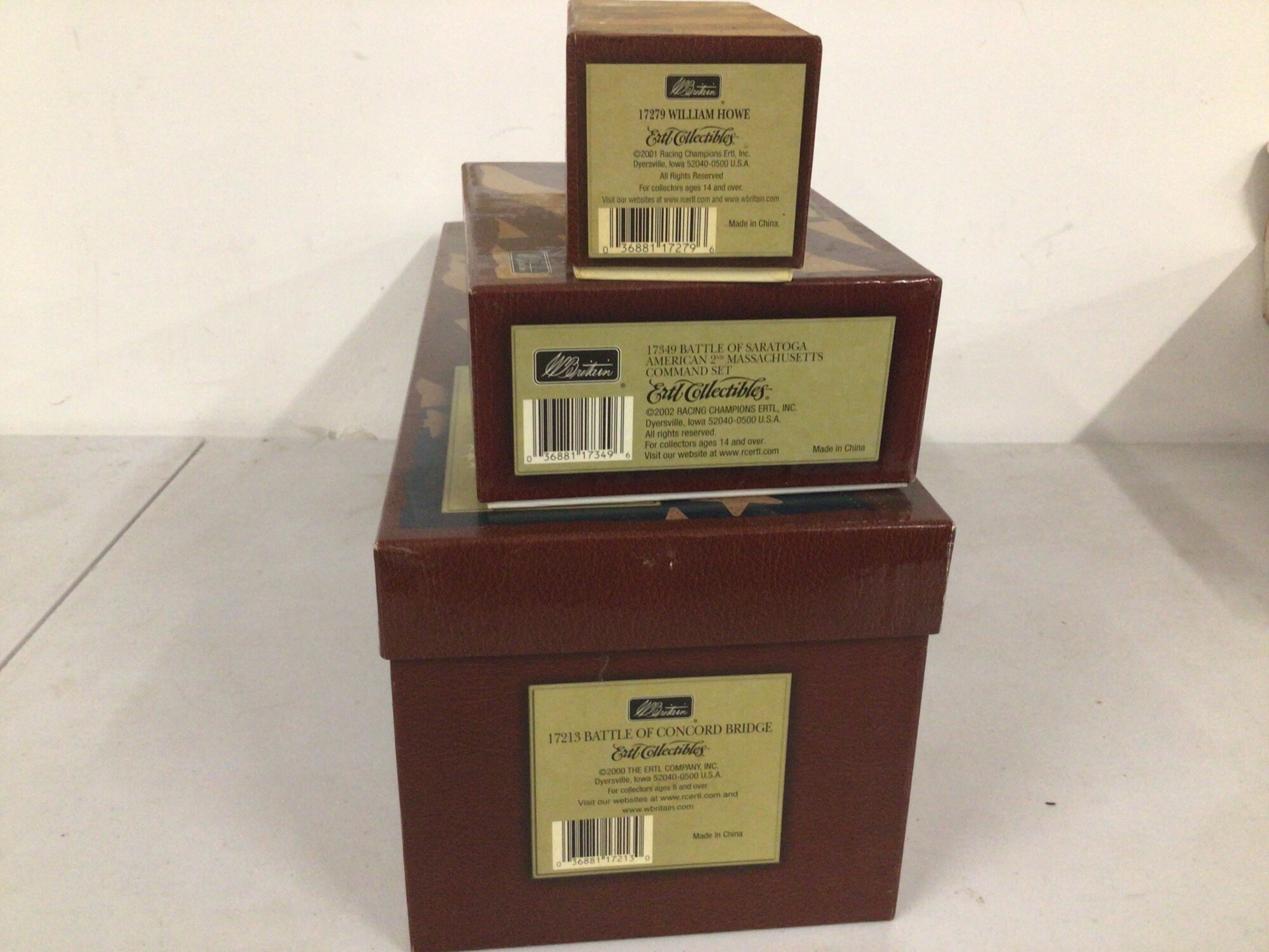 3 x boxed Britains Minature Military Models in the American Revolution series, featuring 17279 William Howe, 17349 Battle of Saratoga American 2nd Command set,  17213 Battle of Concorde Bridge.  No reserve