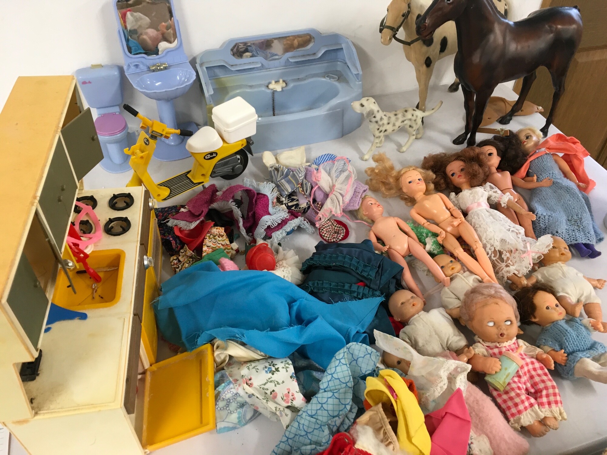Mixed collection of dolls and their accessories includes Sindy and others.  Also includes Nintendo ads and game plus Star Wars spacecraft.  No reserve