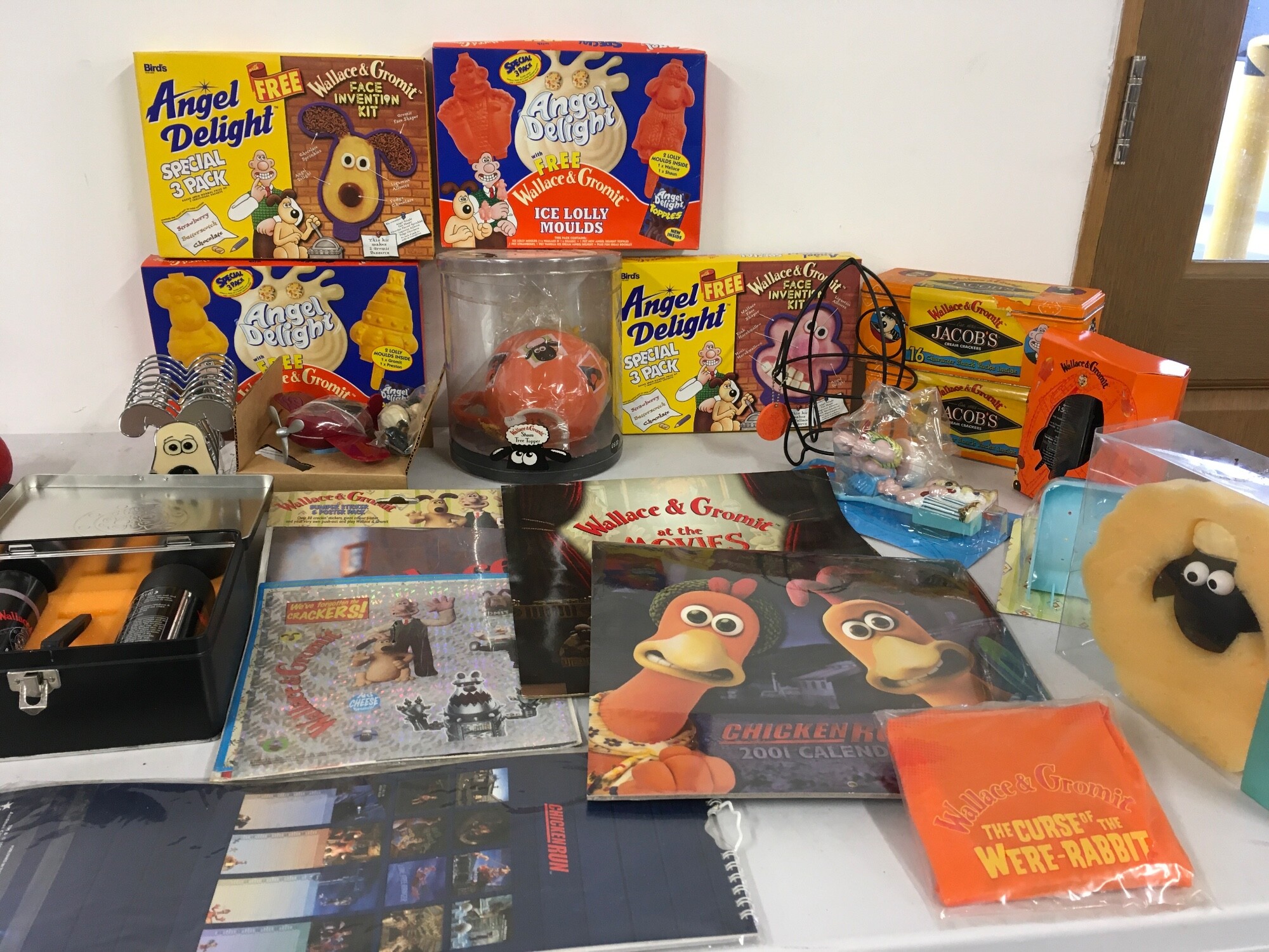 A varied collection of Wallace And Gromit merchandise, including shaving set, calendars.  Includes some food products which are not recommended for consumption.  No reserve