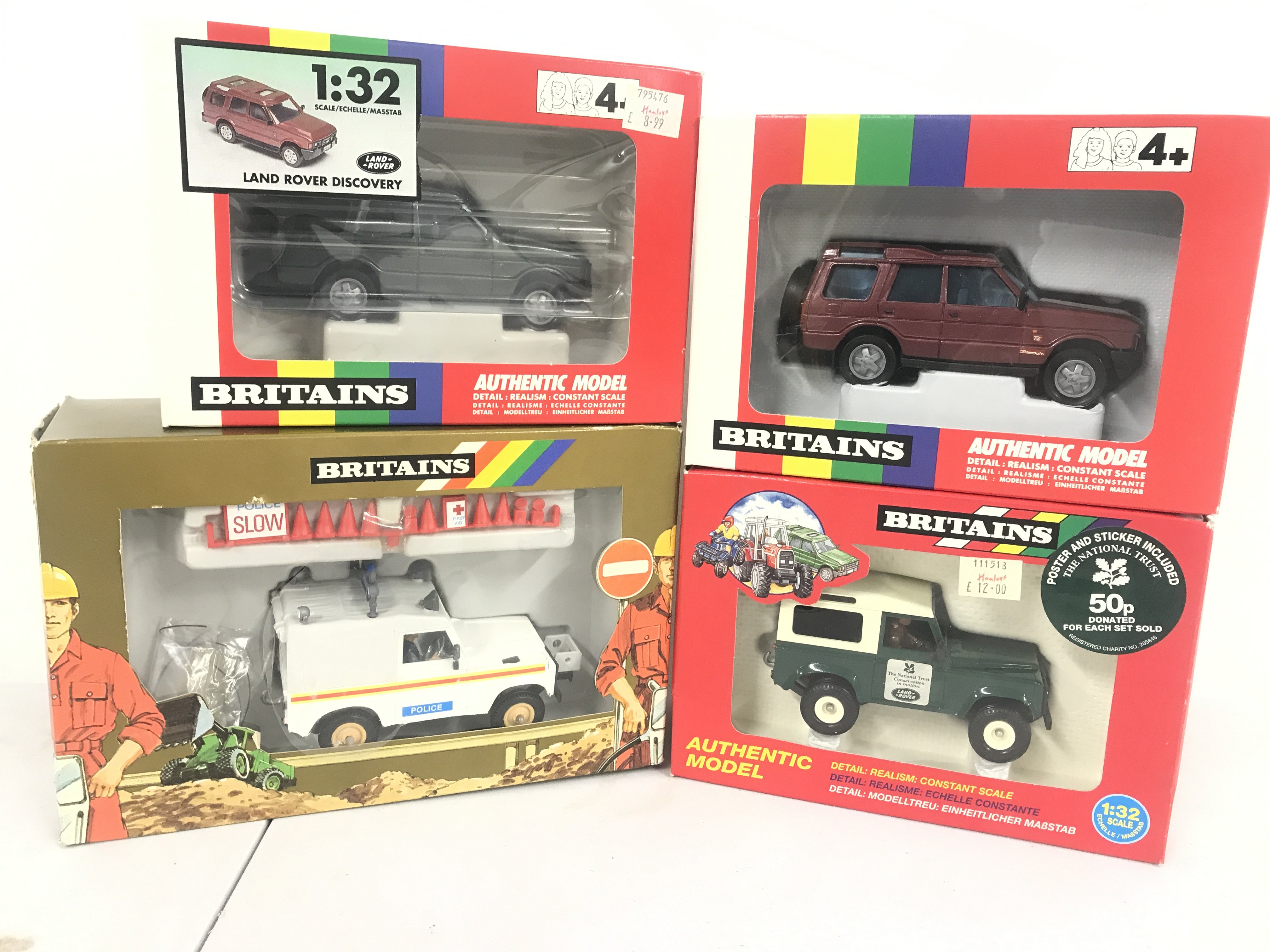 4 Boxed Britains Land Rovers Including 2 X Land Rover Discoverys. A Police Land Rover and A National Trust Land Rover. (4).