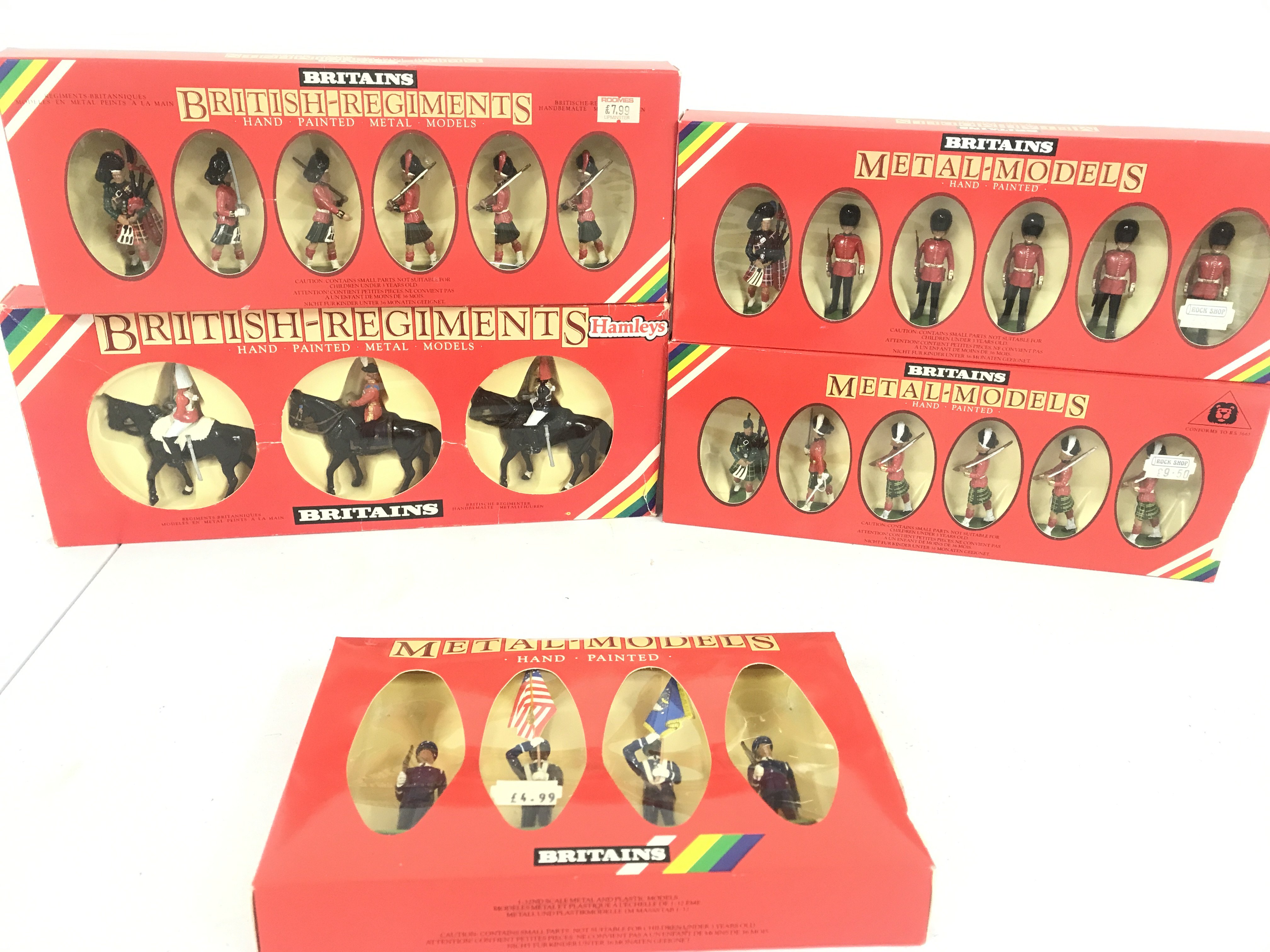 5 Boxed Britains Sets Including U.S. Air Force Colour Party #7307. Her Majesty The Queen Mounted Lifeguard #7233. Black Watch Officer Piper And Men #7237. Scots Guard-Piper #7238 And Gordon's Highlander Officer Piper With Men #7239.(5).