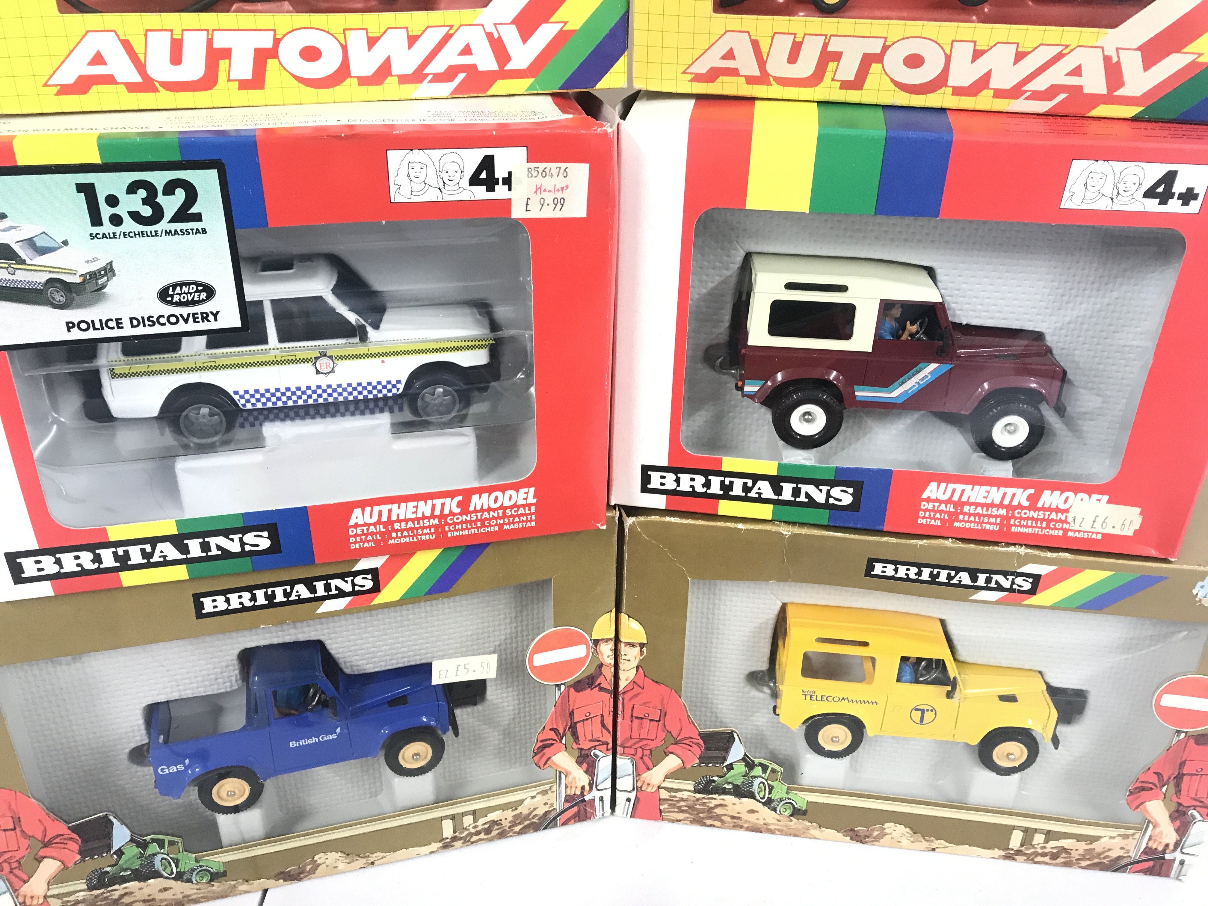 A Collection Of Boxed Britains Land Rovers. Autoway Sets And A Milking Parlour.(7).