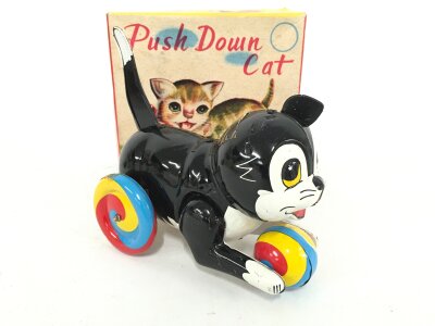 A Boxed Tinplate Japanese Push Down Cat. Missing One Ear.