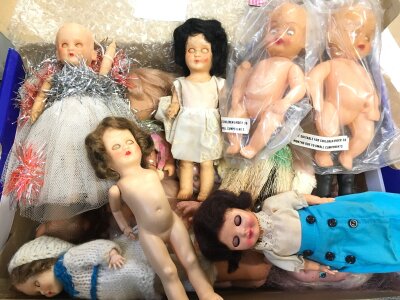 A Box Comtainimg Small Vintage Dolls.