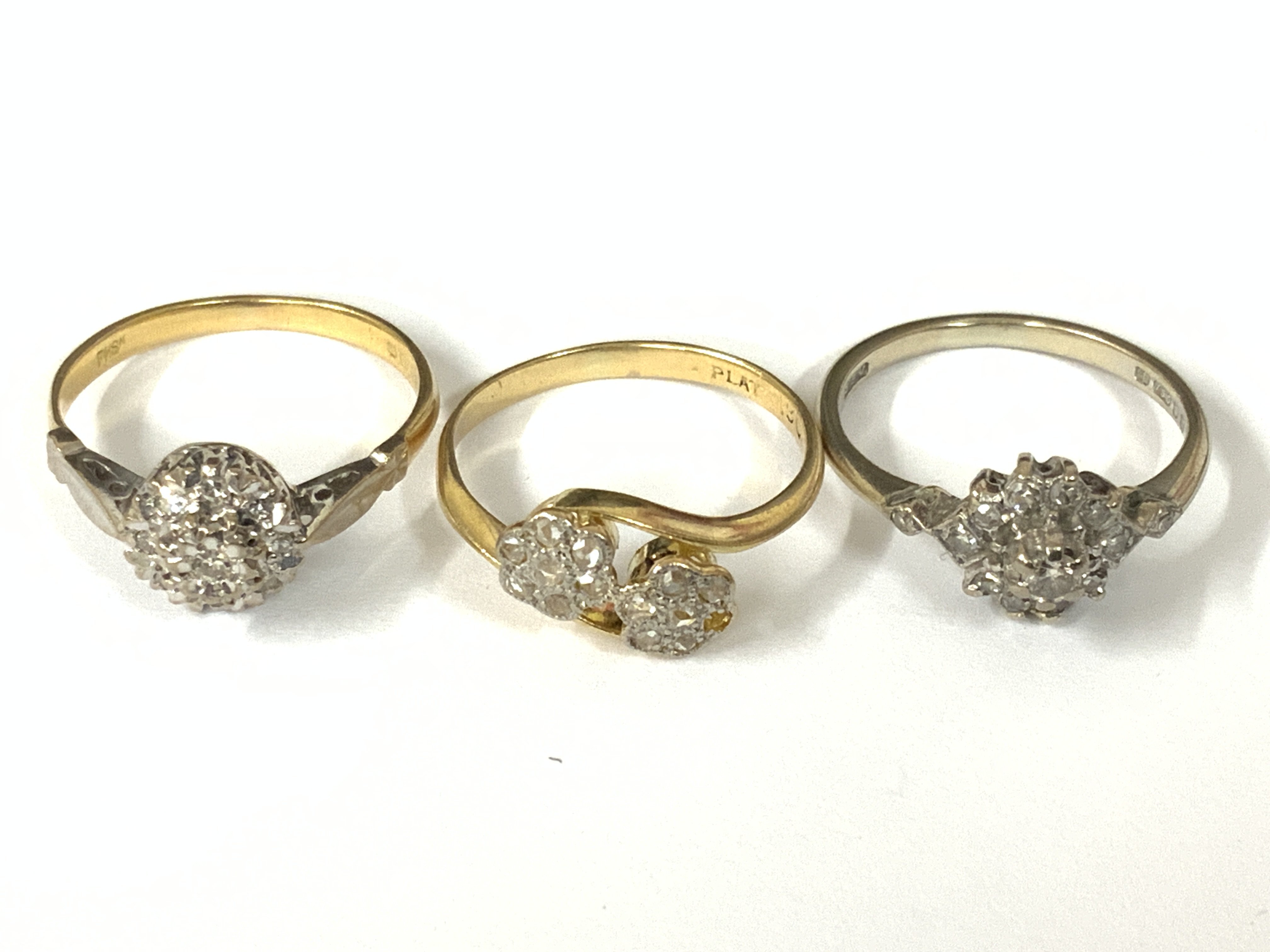 Three 18ct gold diamond cluster ring, (x1 white gold). Approx ring size L. Approx 7.2g. Postage category A