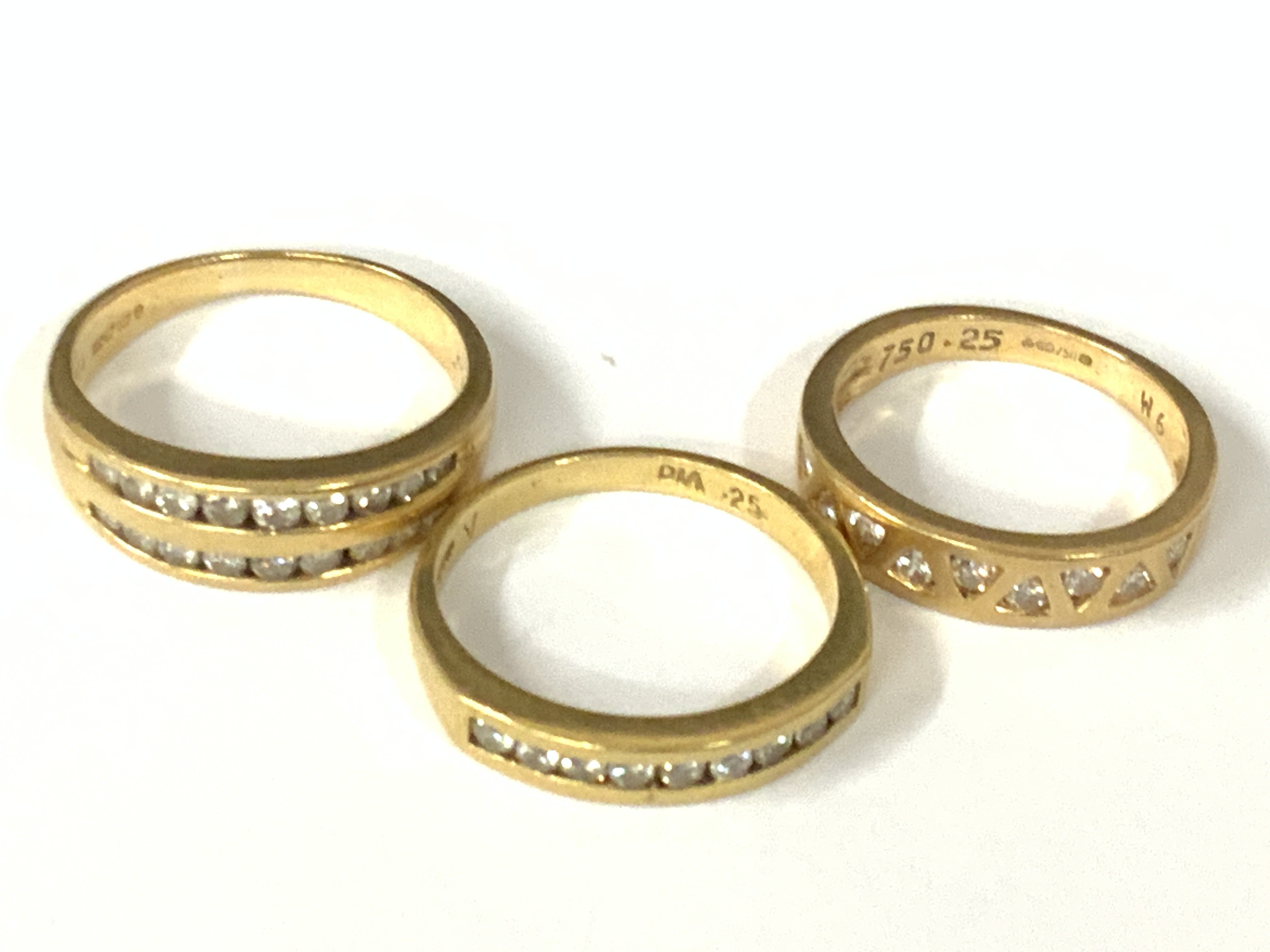 Three 18ct gold diamond half hoop rings. Approx ring size K,N. Approx 10.9g. Postage category A
