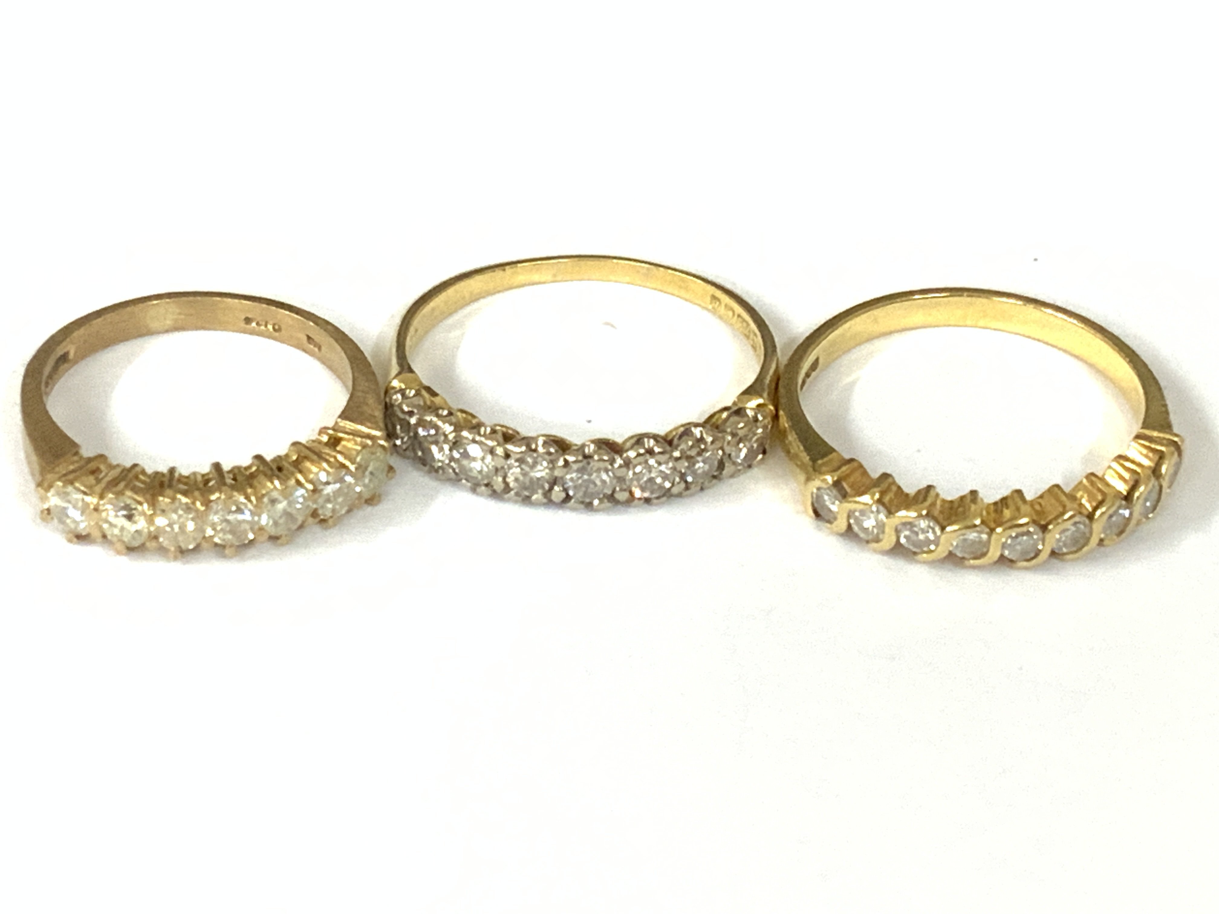 Three 18ct gold diamond half hoop rings. Approx ring size J,N,P. Approx 7.5g. Postage category A