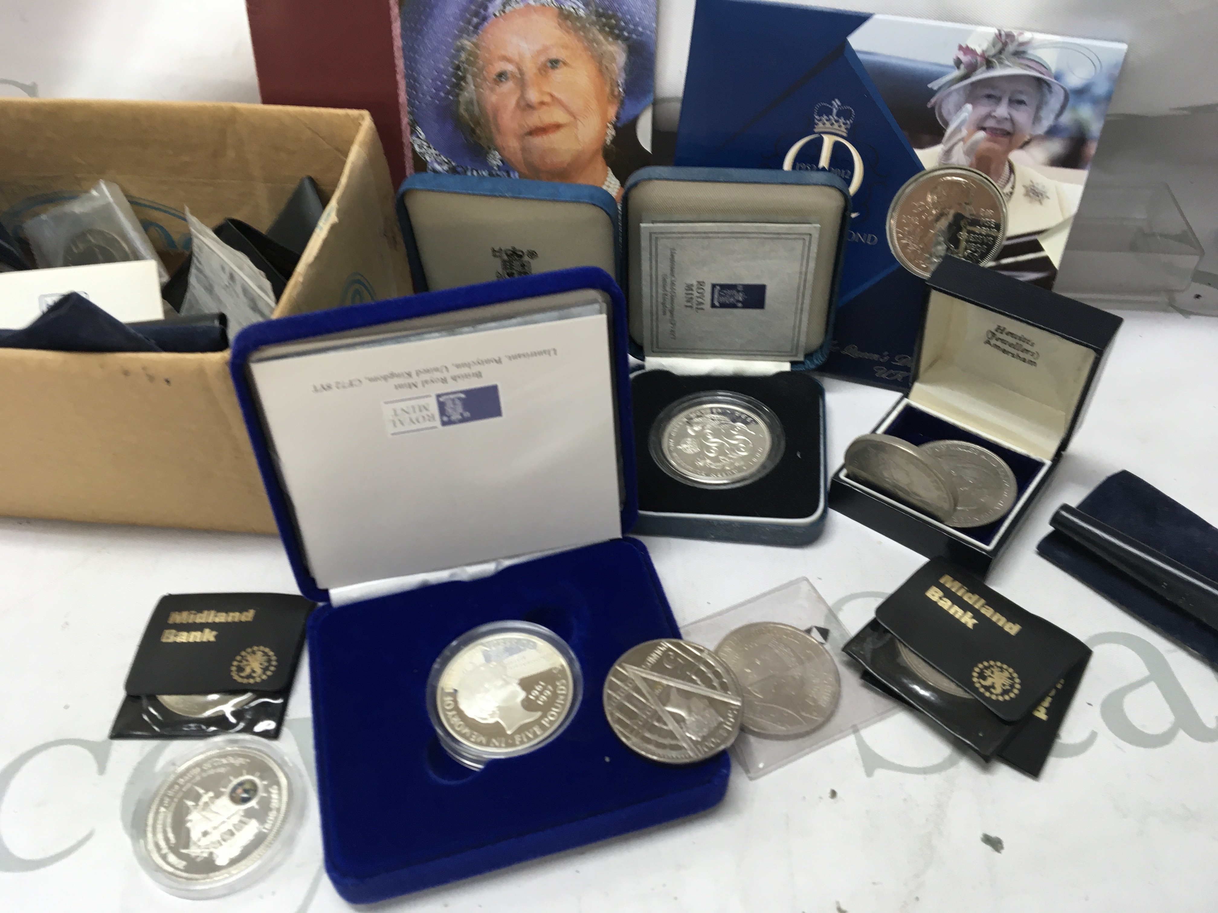 A collection of coins including Royal mint silver proof.