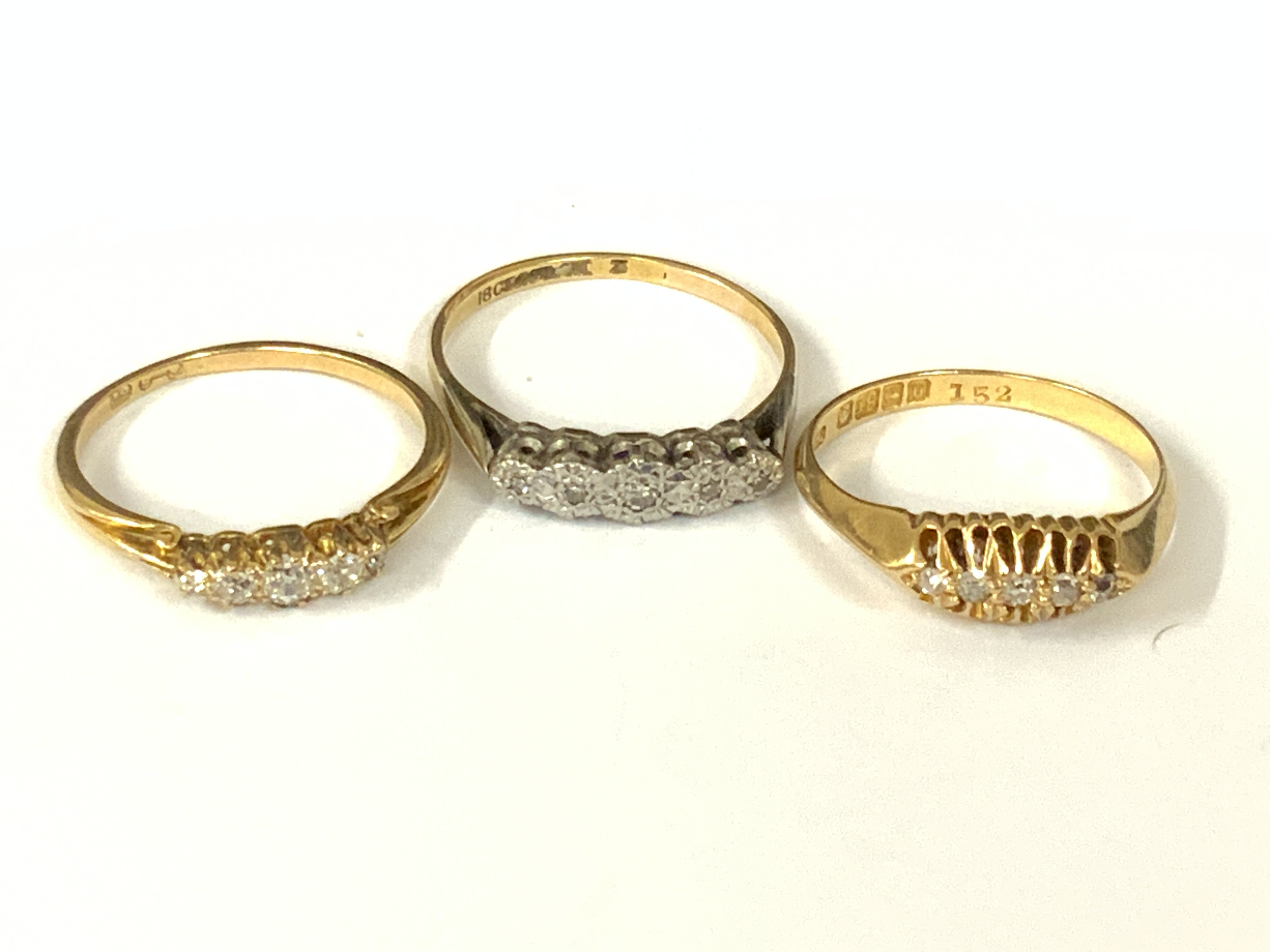 Three 18ct five stone diamond rings. Approx ring size O,P,Q. Approx 8.4g. Postage category A