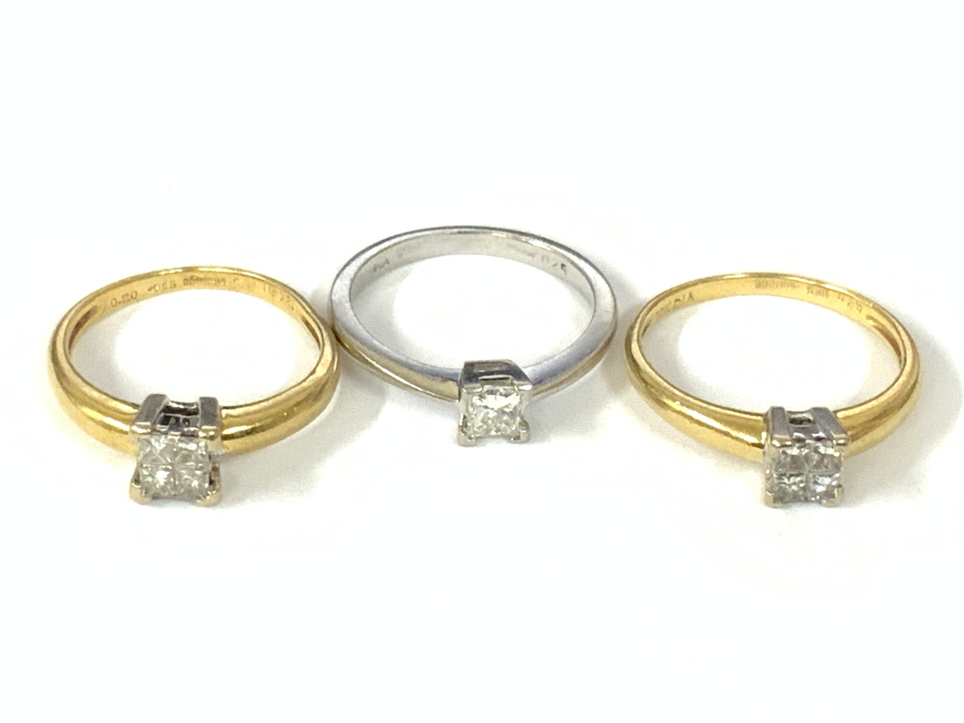 Three 18ct gold princess cut diamond solitaire rings (x1 white gold). Approx ring size K,J,M. Approx 8.2g. Postage category A