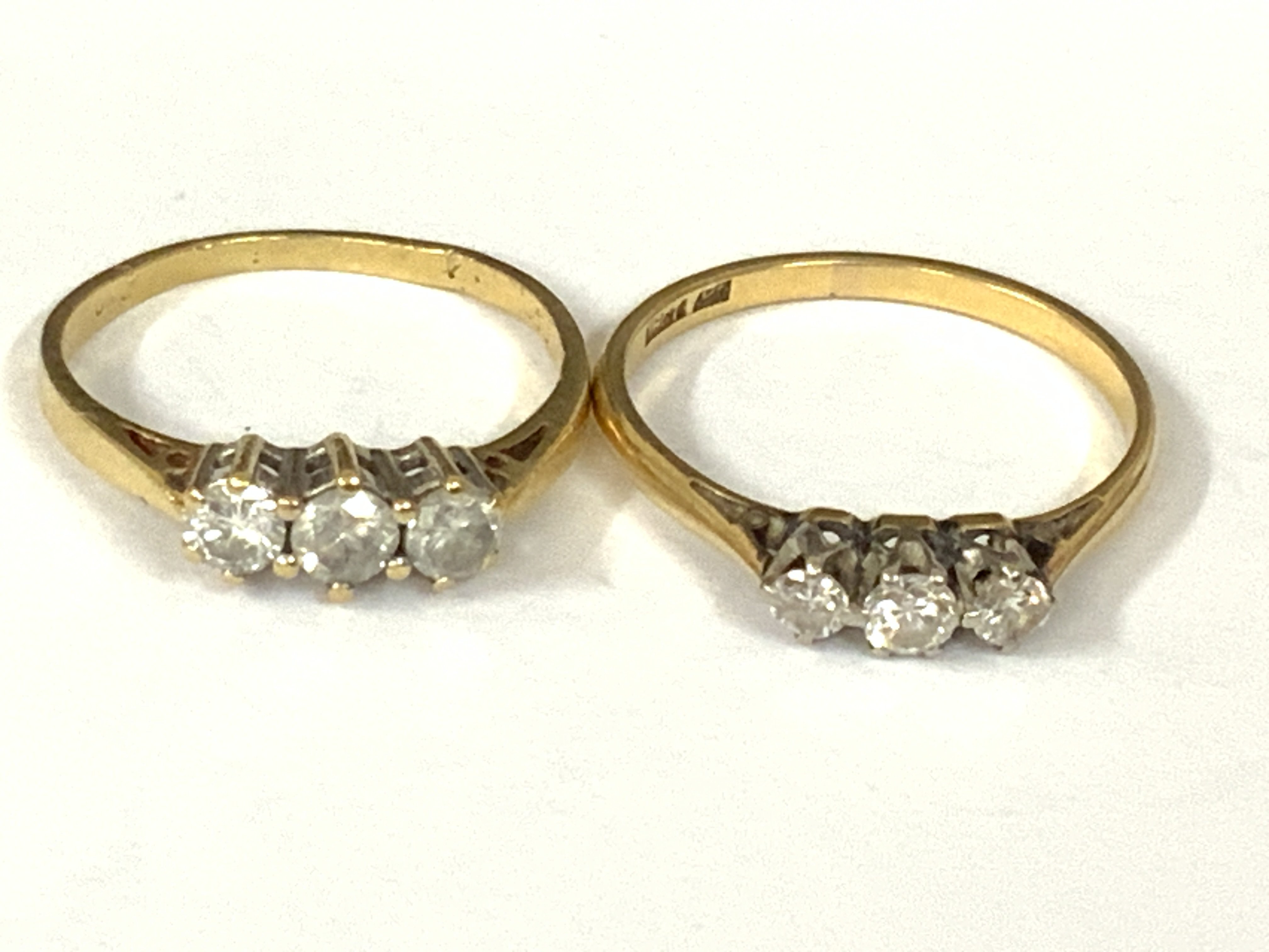 Two 18ct gold three stone diamond rings. Approx ring size N,O,P. Approx 4.6g. Postage category A