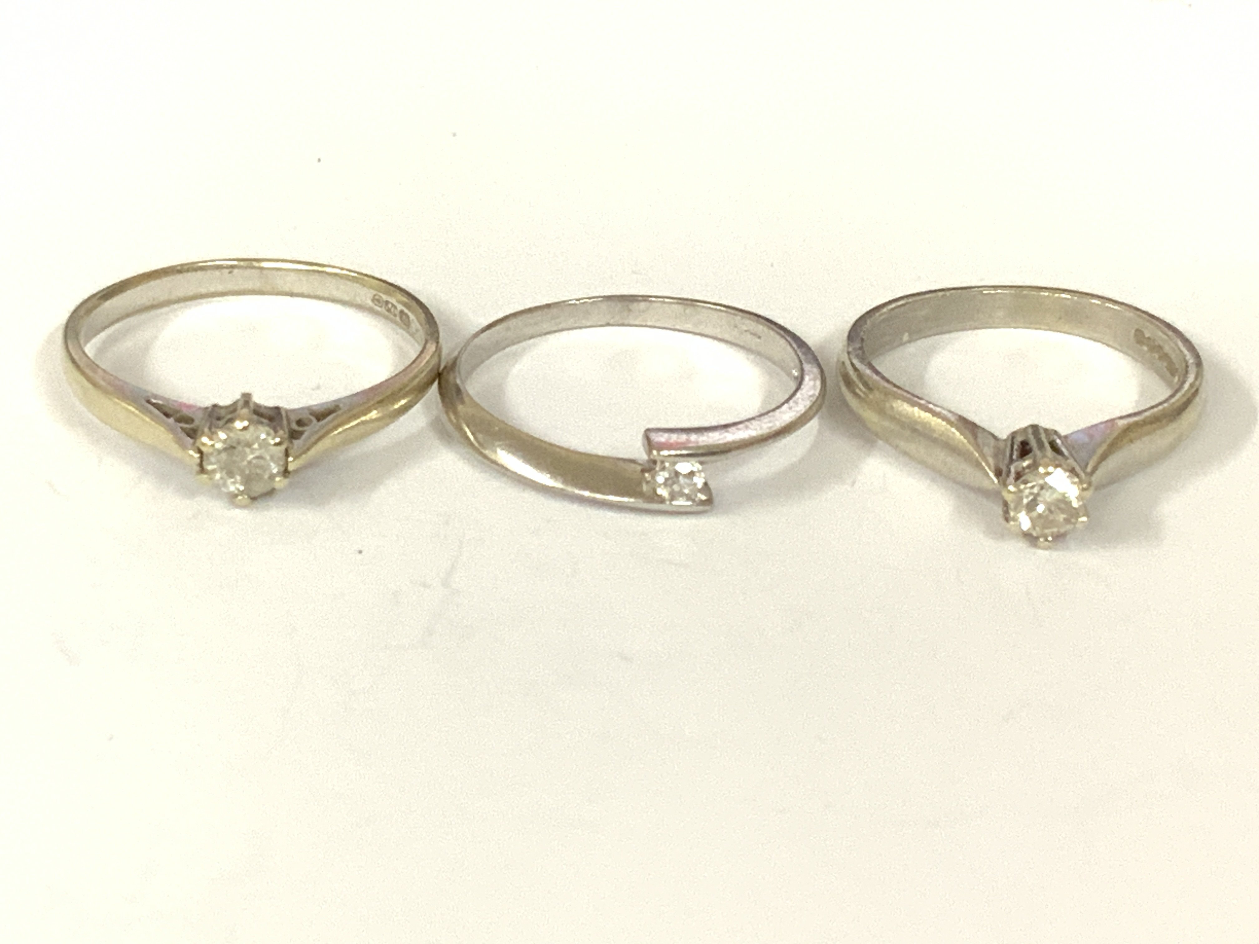Three 9ct white gold diamond rings. Approx ring size L,O,Q. Approx 5.8g. Postage category A