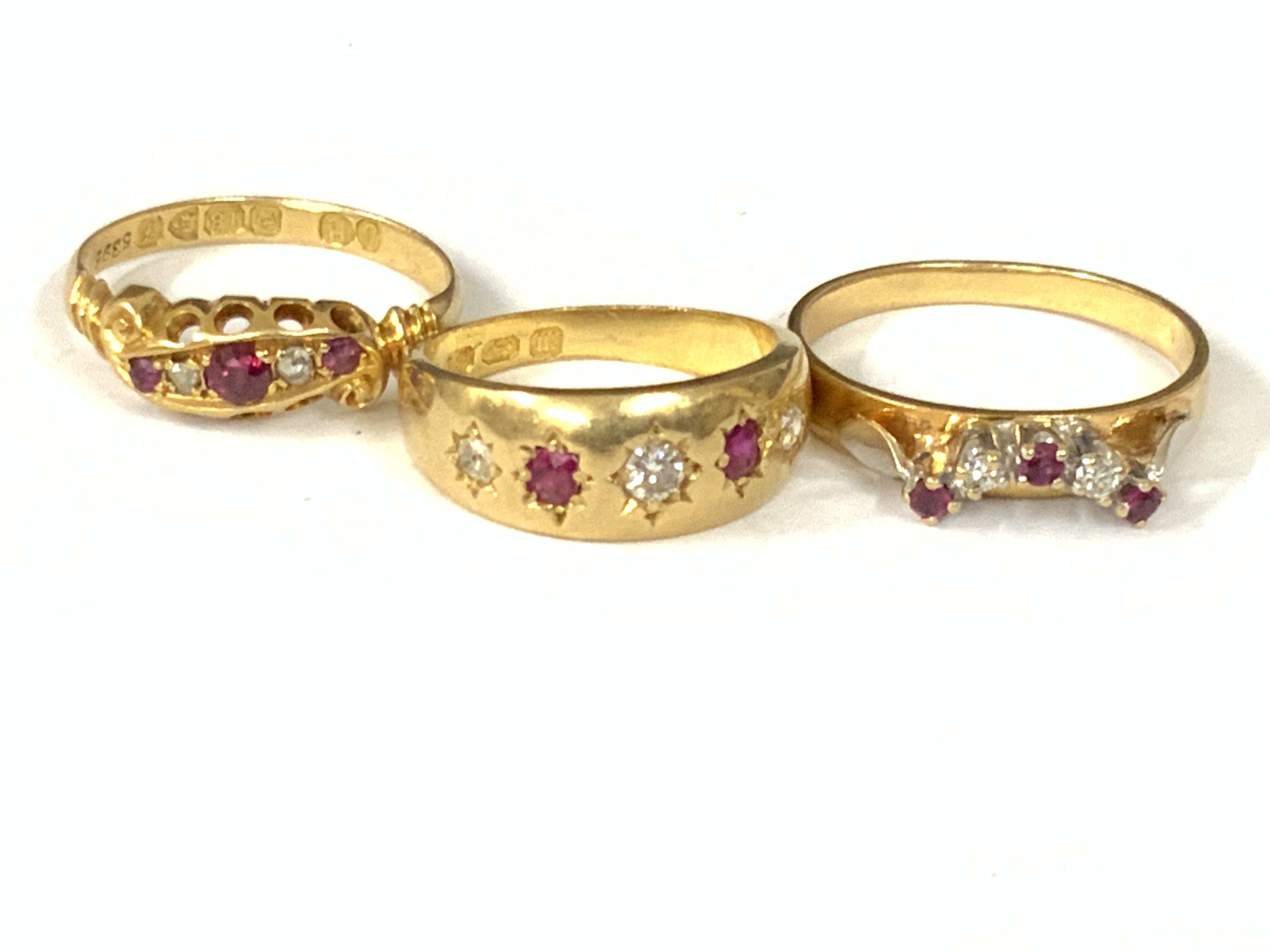 Three 18ct gold ruby / diamond five stone rings. Approx ring size H,L,N. Approx 8.9g. Postage category A