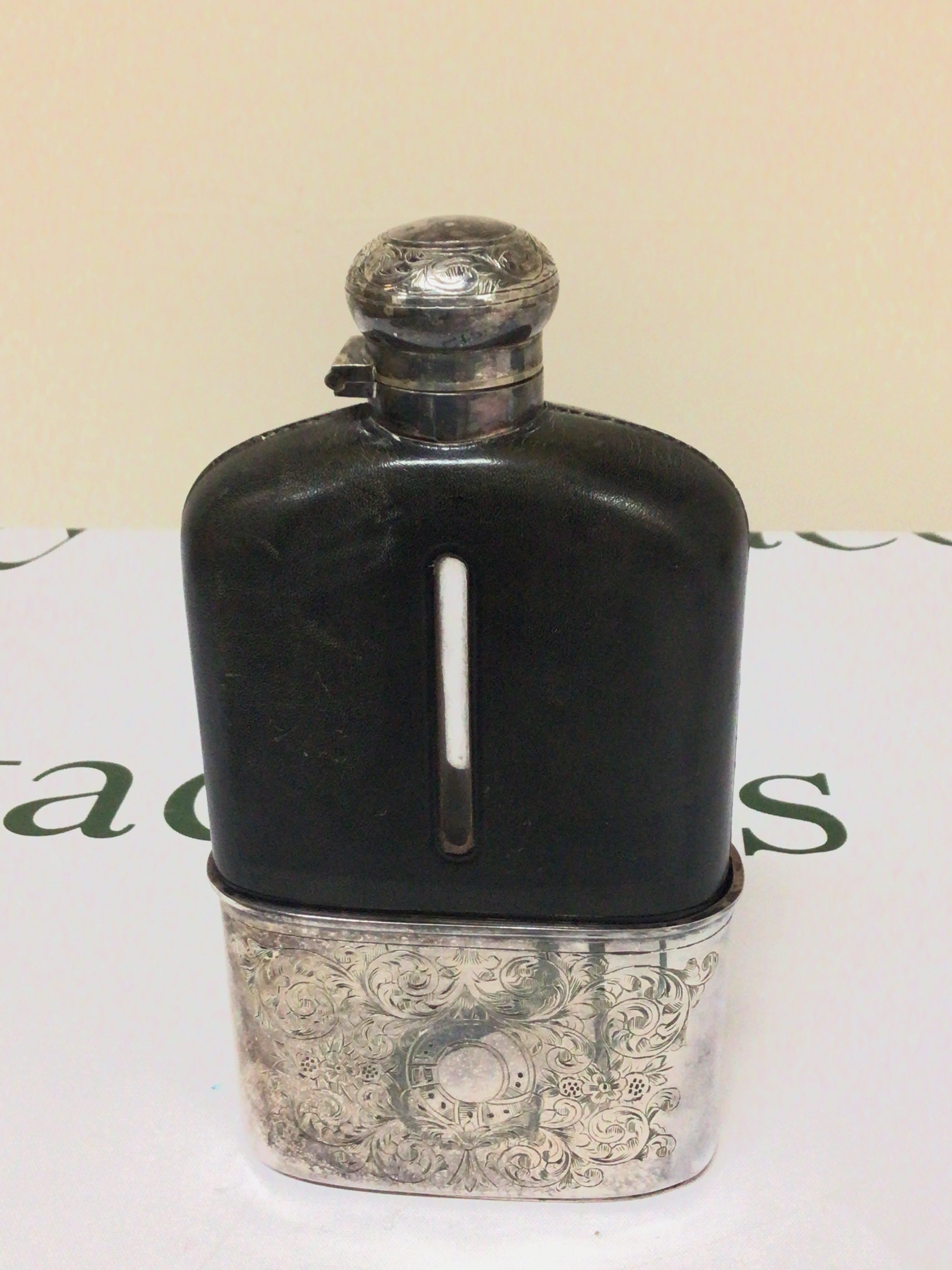 A late Victorian hip flask half pint size with a screw cap top detachable silver plated cup base leather lined bottle nice condition. Height 18cm