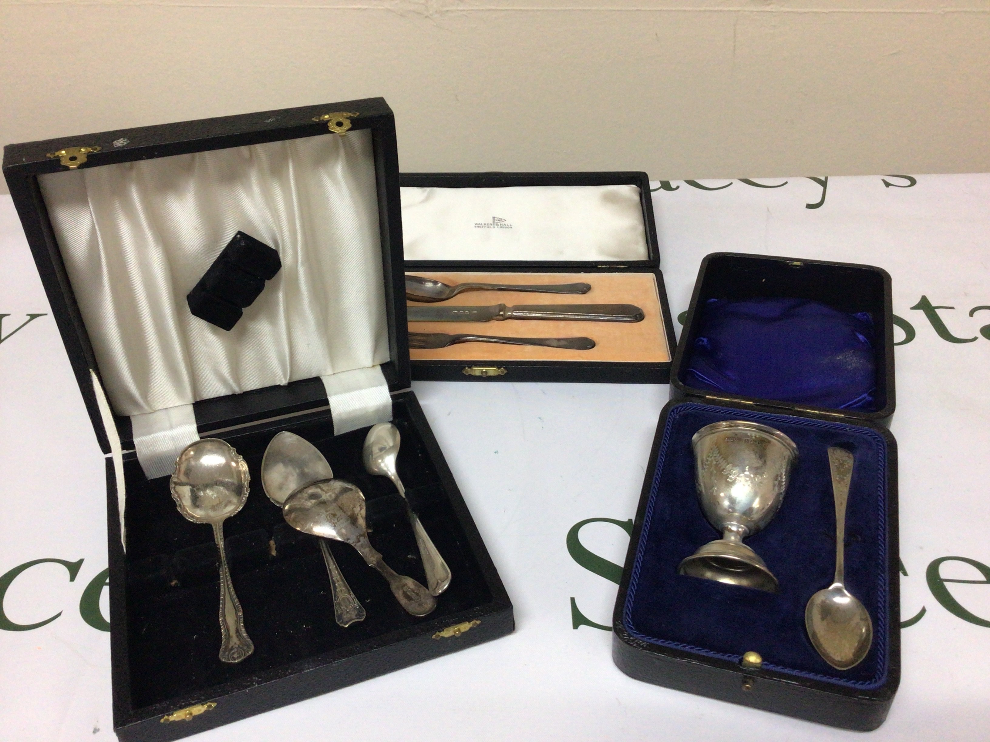 Cased silver egg cup and spoon a silver tea caddy spoon cased Walker Hall cutlery and other oddments