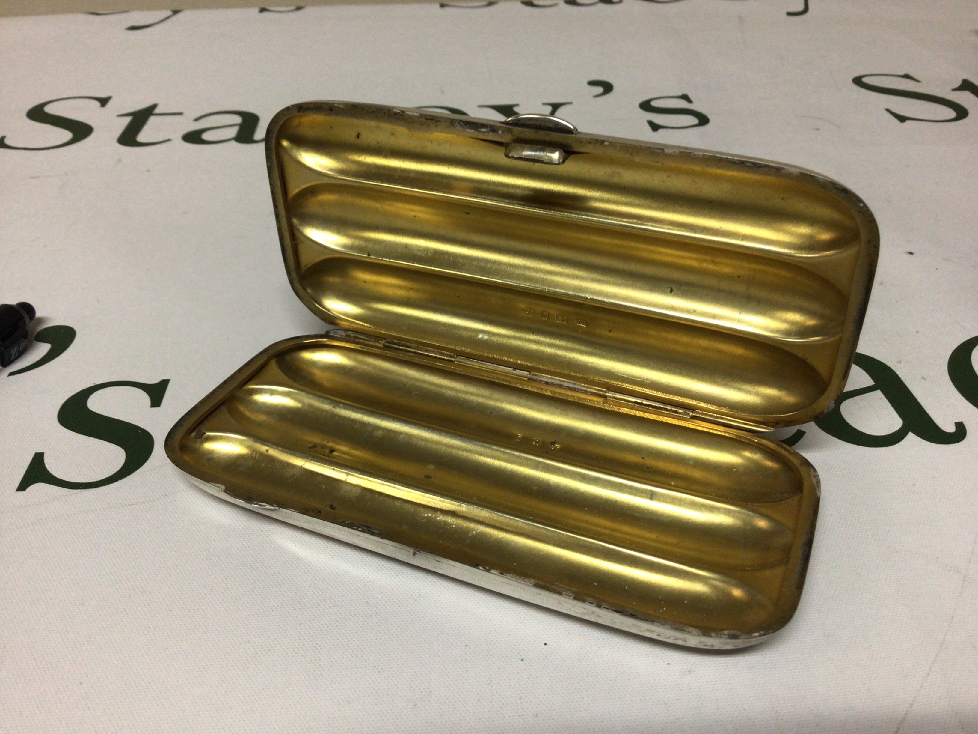 A quality Silver there section parcel gilt cigar holder nice condition no personal inscriptions. Birmingham hallmarks.