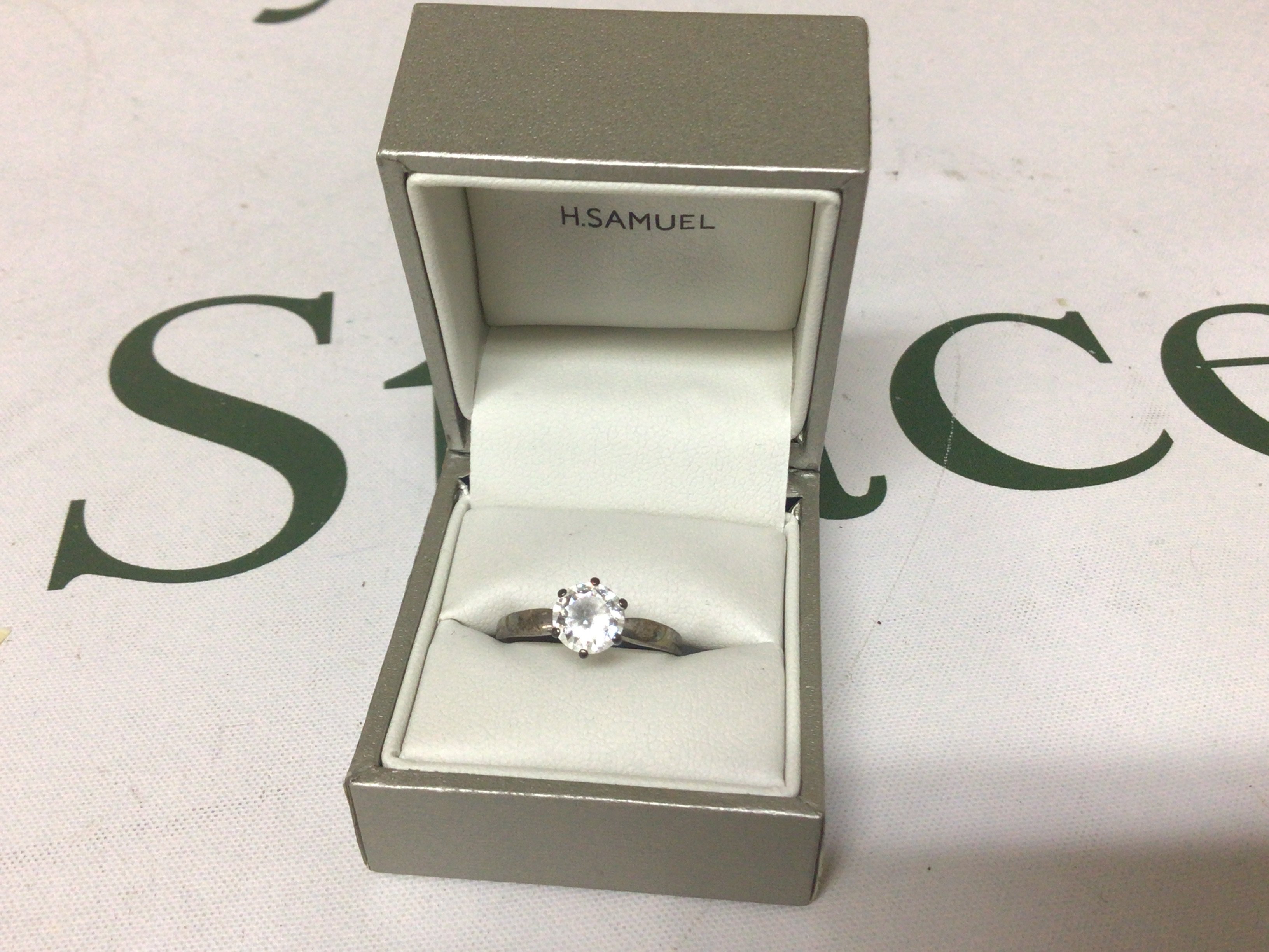 A 9carat white gold ring set with a CZ stone weight 2.3g approximately.