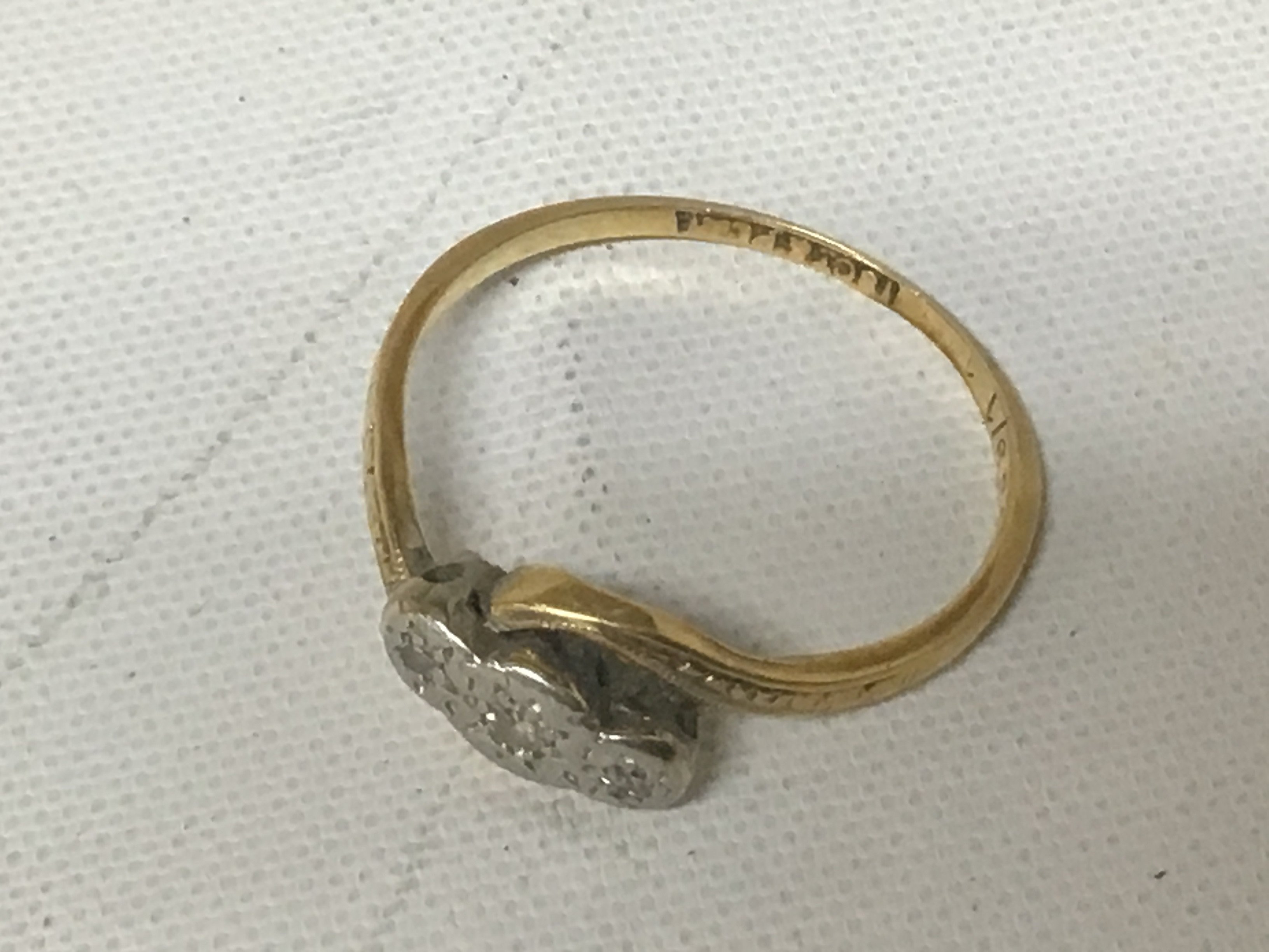 An 18carat gold ring set with chip diamonds weight 1.9g approximately.