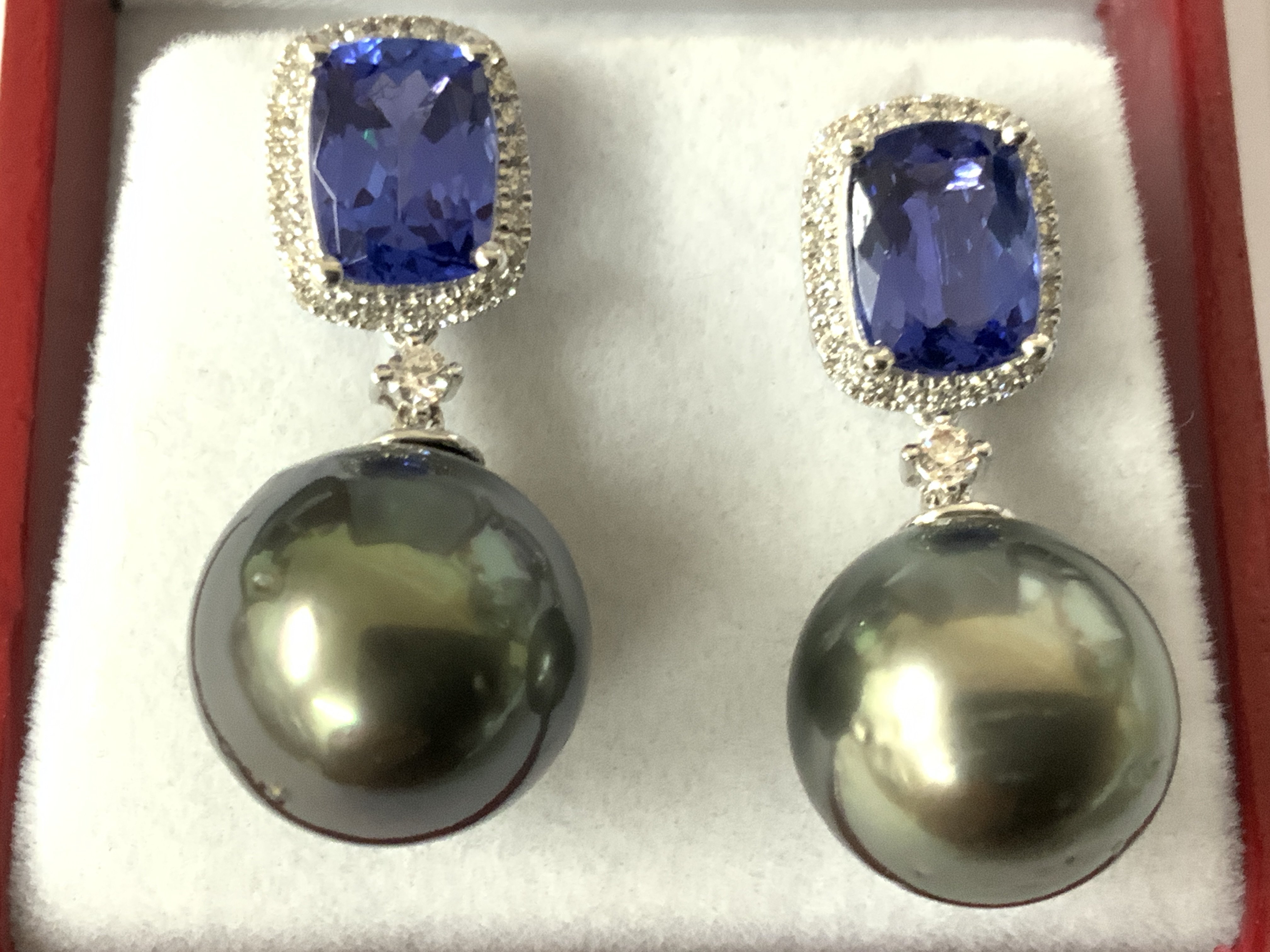 Pair of 18ct white gold droplet earrings with suspended large grey pearls and cushion tanzanites and diamonds set to the bales, boxed. Tanzanites 3.24ct. R/C diamonds 0.27ct. Postage category A.